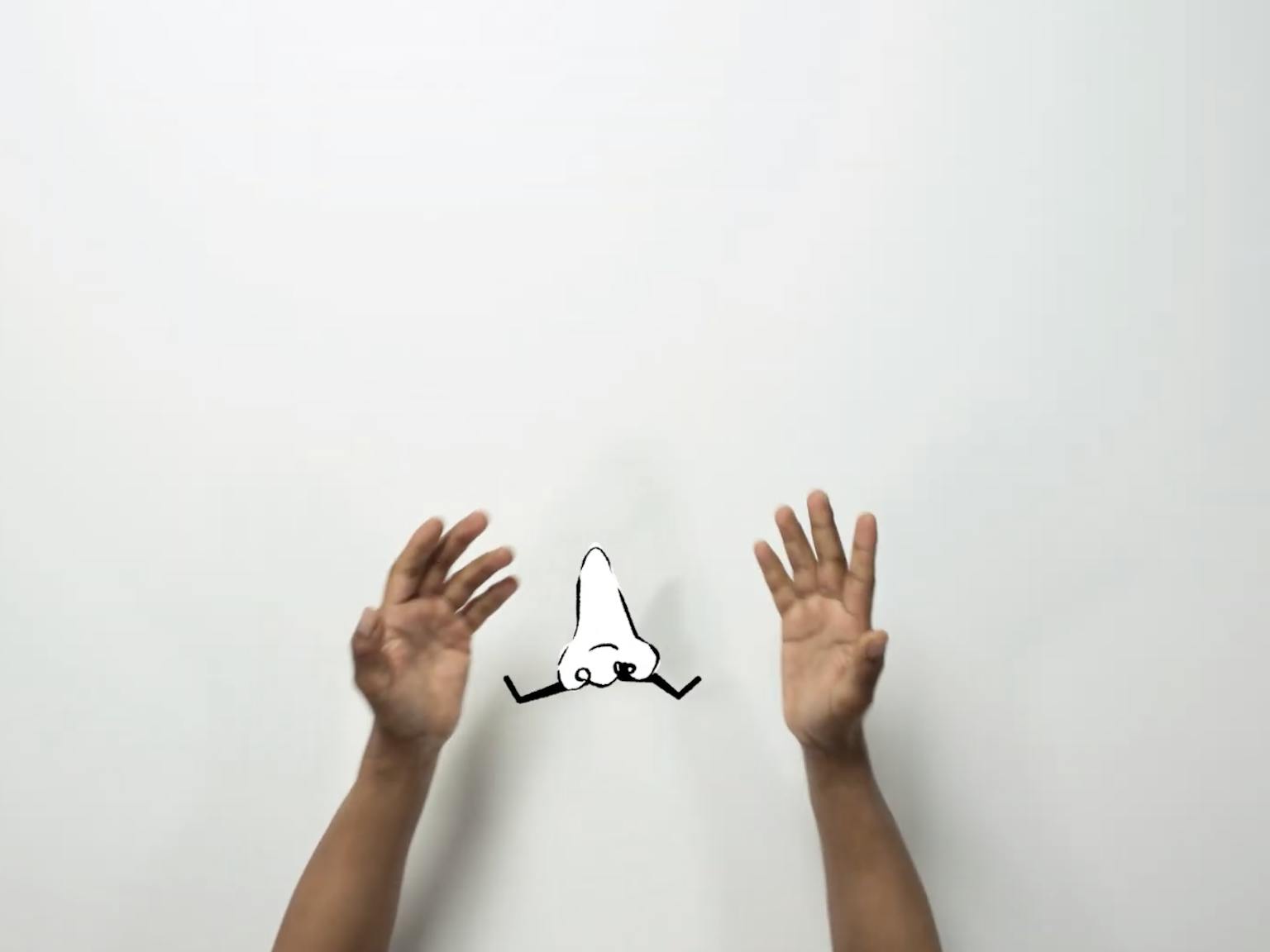 Two hands on a white background with an animated nose in the middle