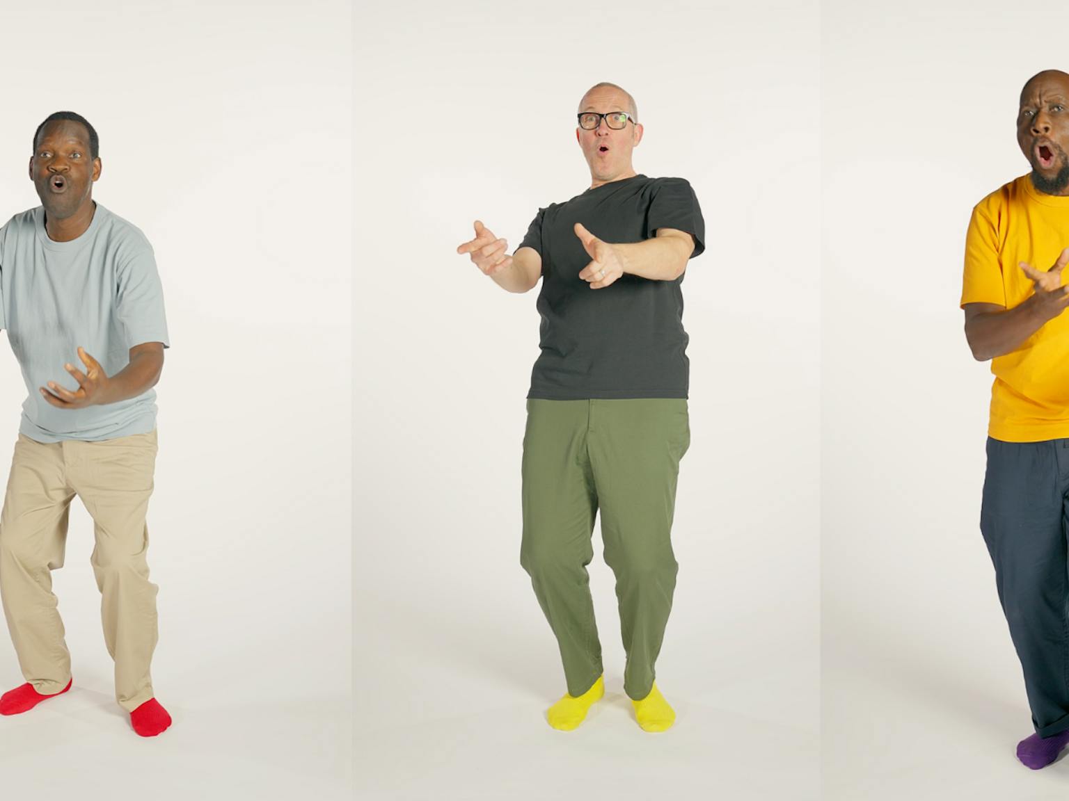 Three artists in different positions dancing