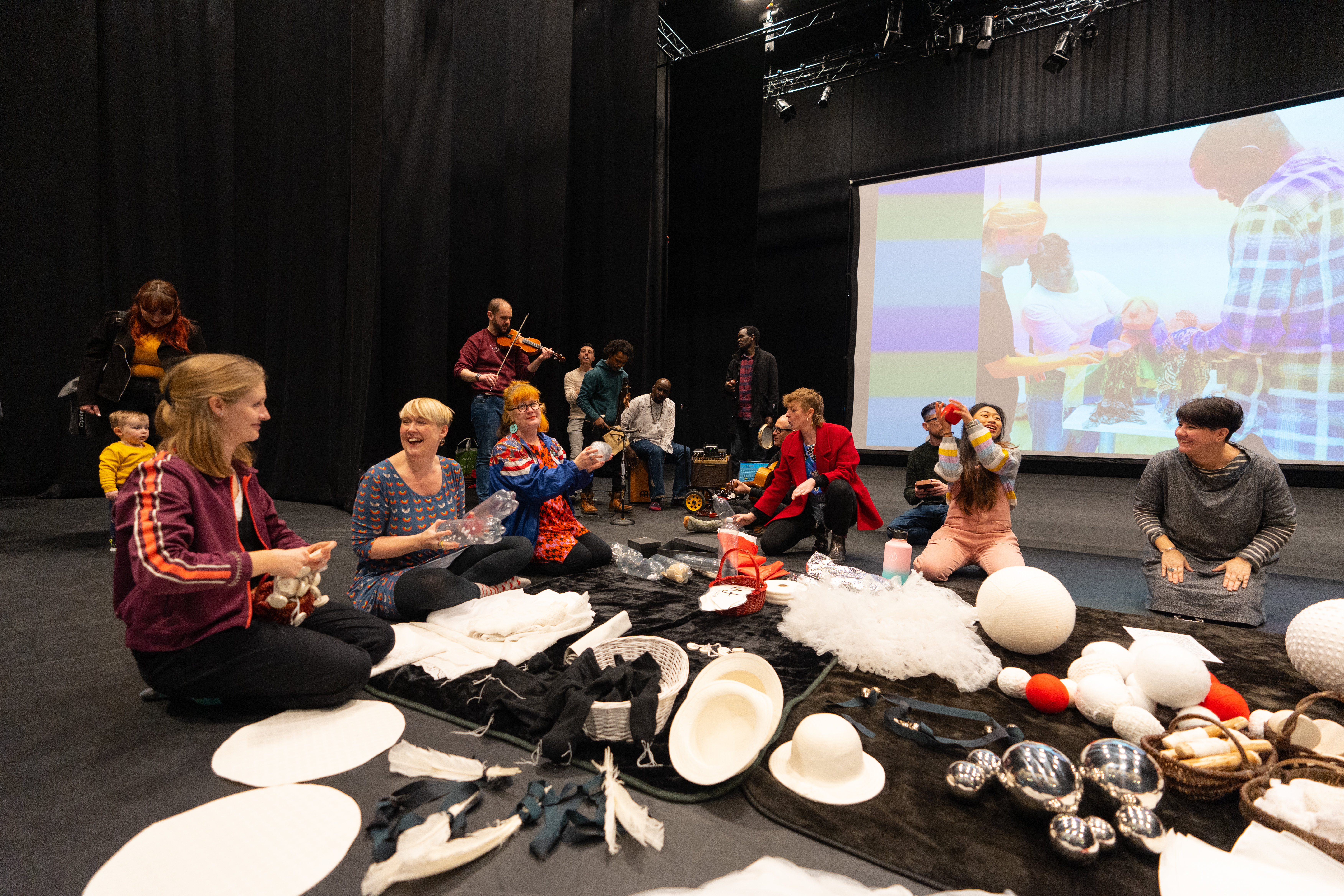 Playground artists making music and interacting with each other 