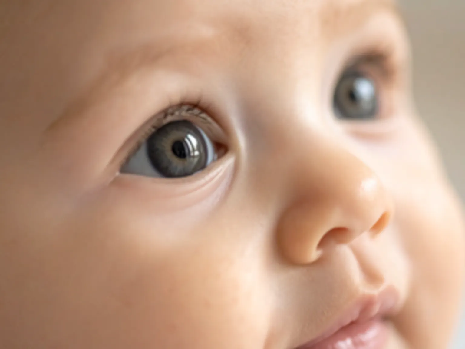 Two babies looking up