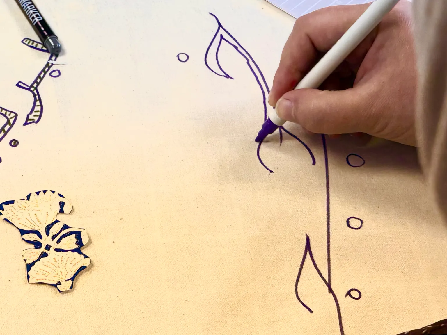 A close up of a woman drawing an illustration