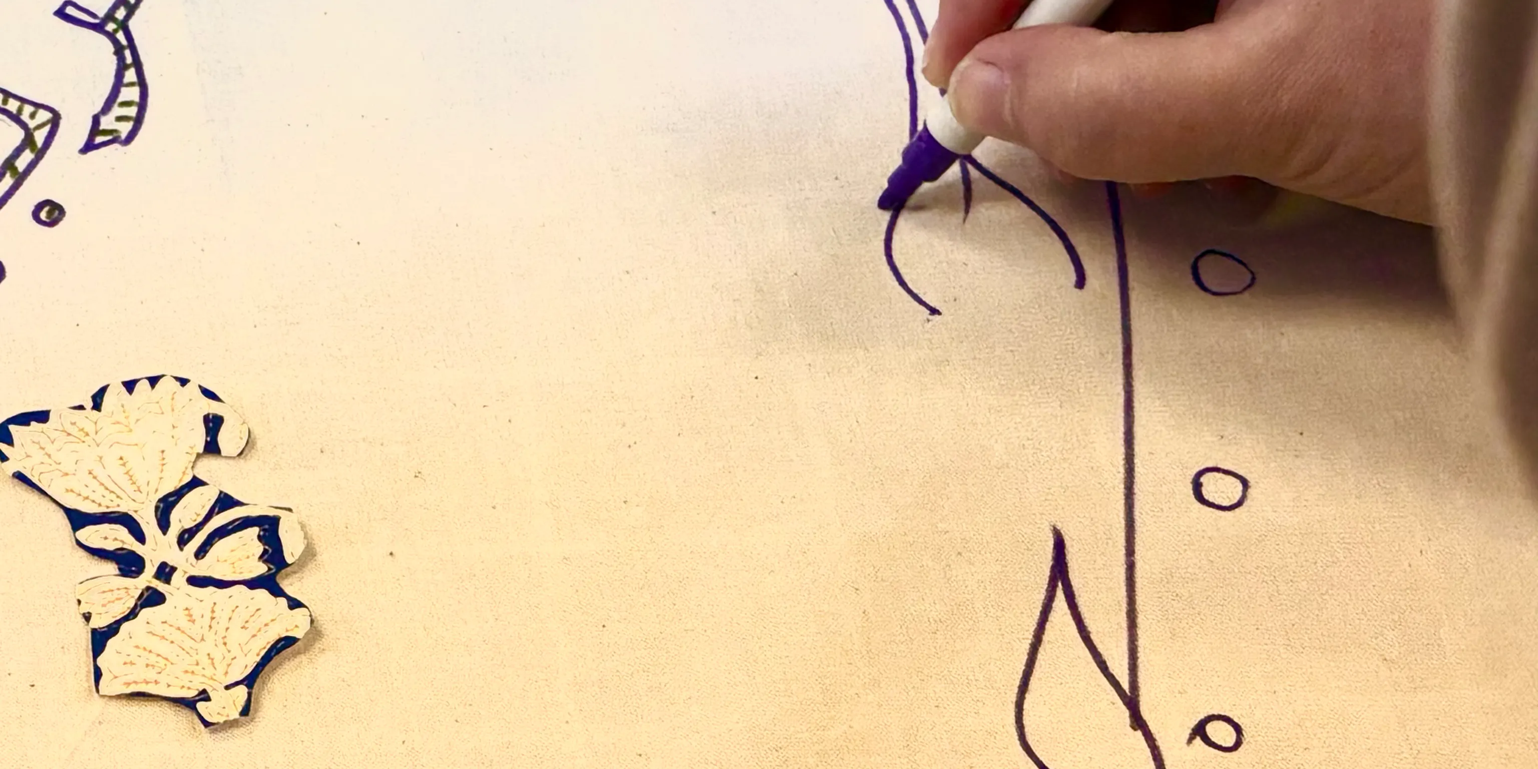 A close up of a woman drawing an illustration