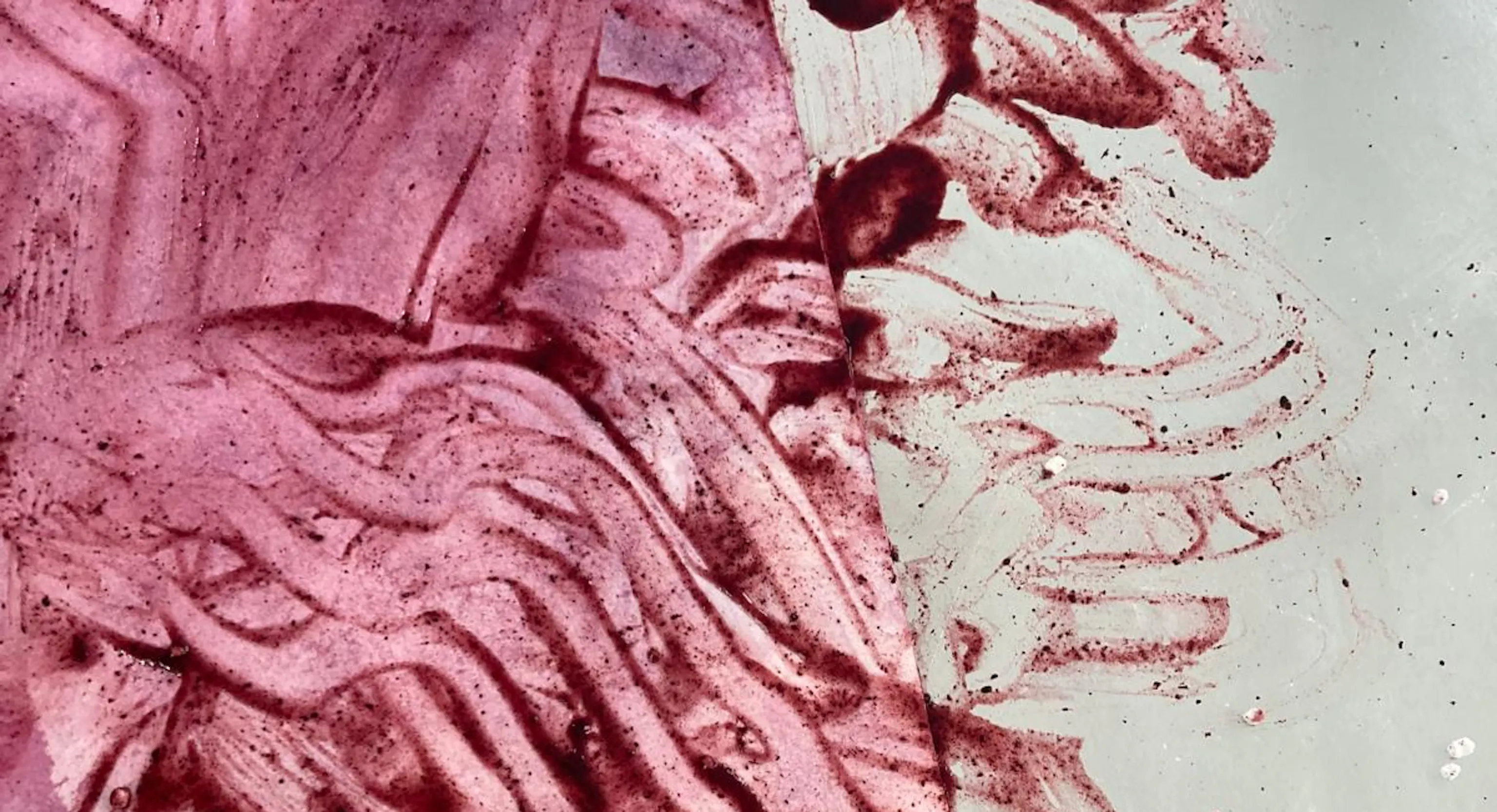 A pink and purple abstract painting created using blended food materials lemon and blueberry.