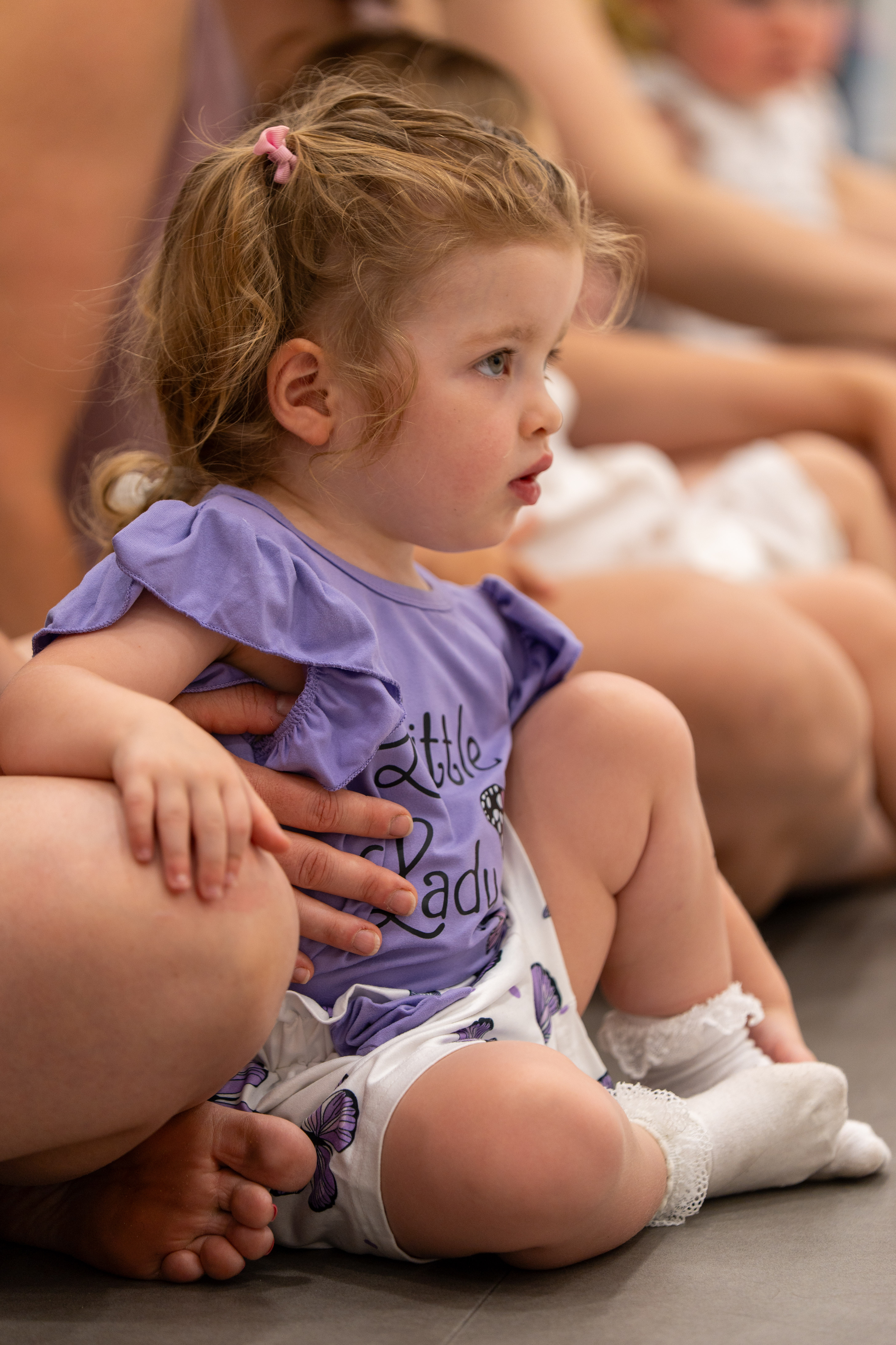 A young child looking at a performance 