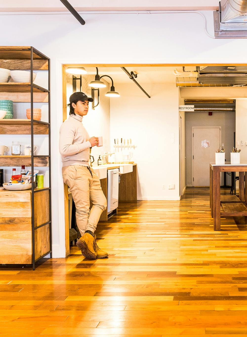 man standing in kitchen at plotly headquarters montreal