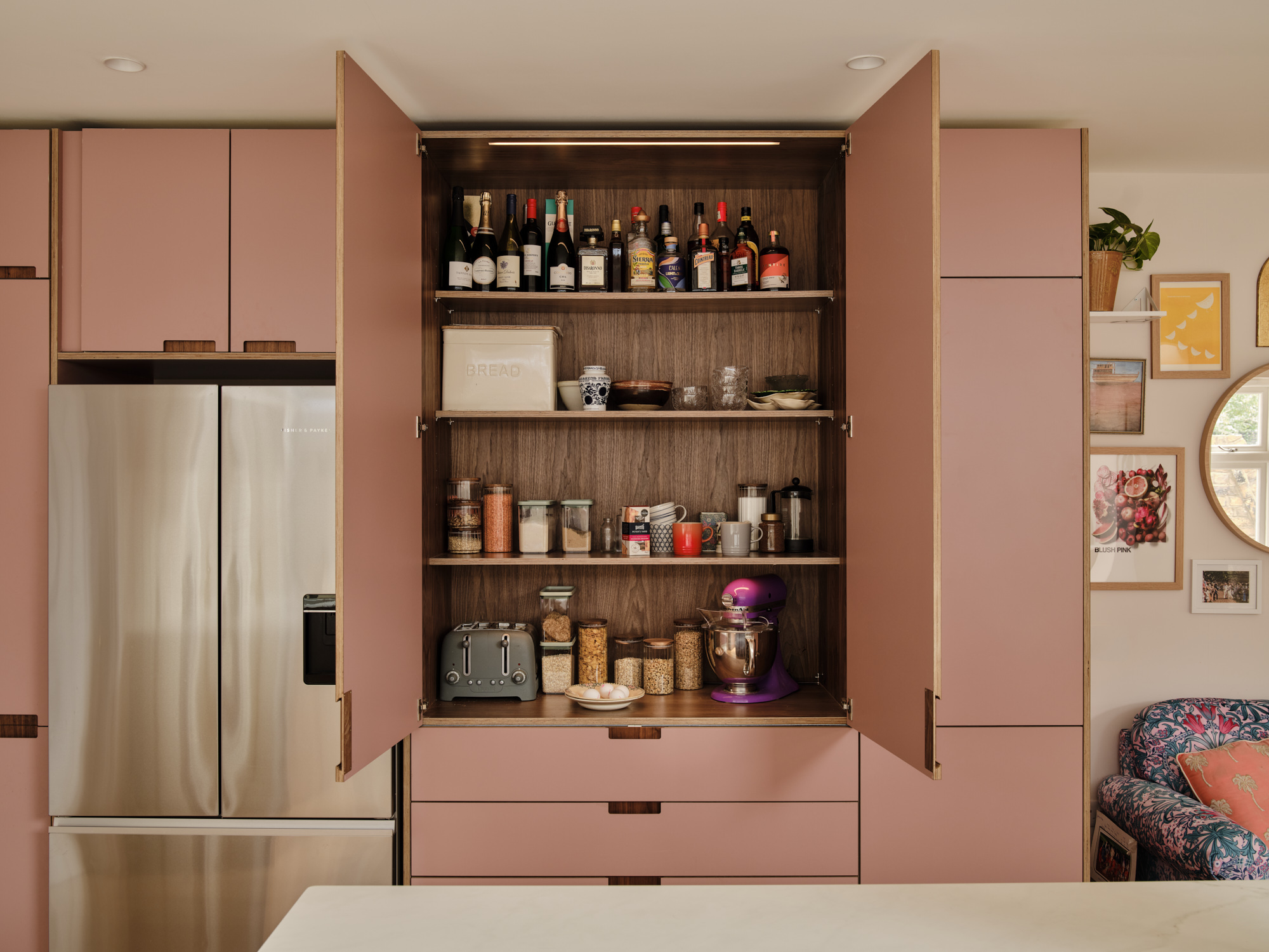 Plykea walnut pantry unit with Formica Blush doors sits neatly atop IKEA drawers 