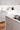 Fenix Grigio Efeso faced ply and Fenix backed semi-recessed handles on the island