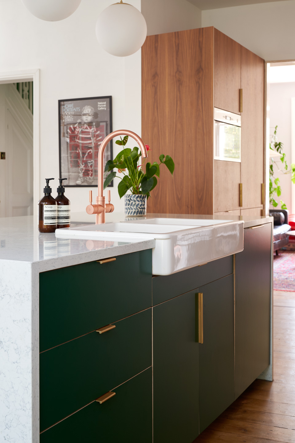 Hunter Green Formica, Walnut ply and brass edge pulls in our Forest Drive kitchen