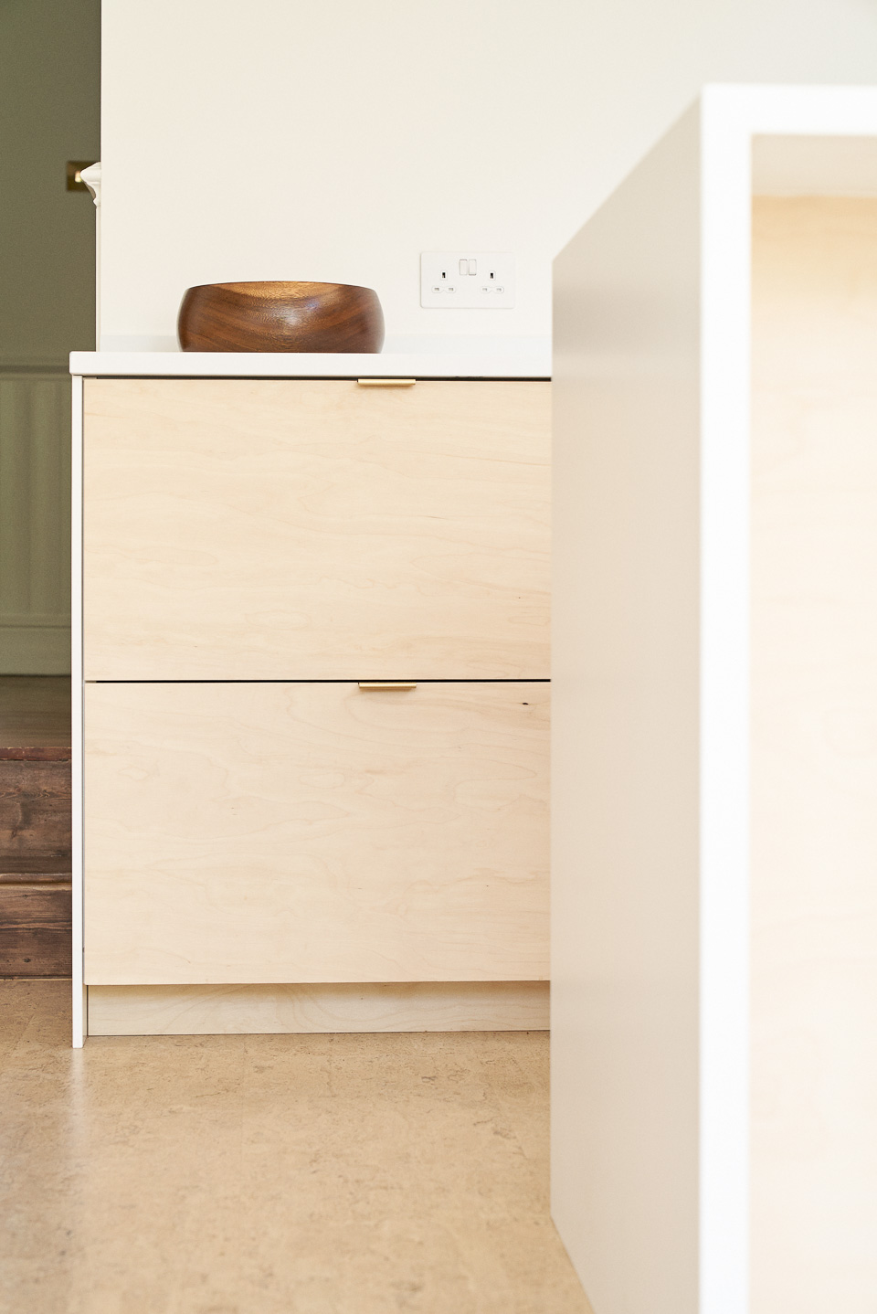Birch plywood fronts and brass edge pulls handles in our Greville Road kitchen