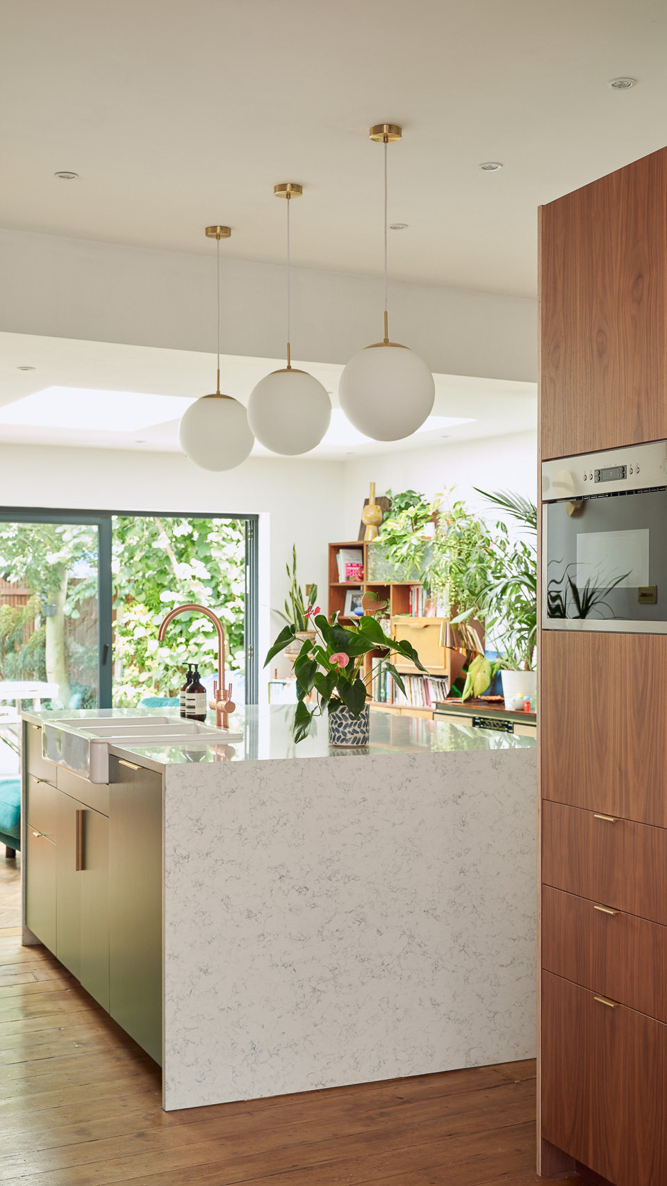 Hunter Green Formica, Walnut ply and brass edge pulls in our Forest Drive kitchen
