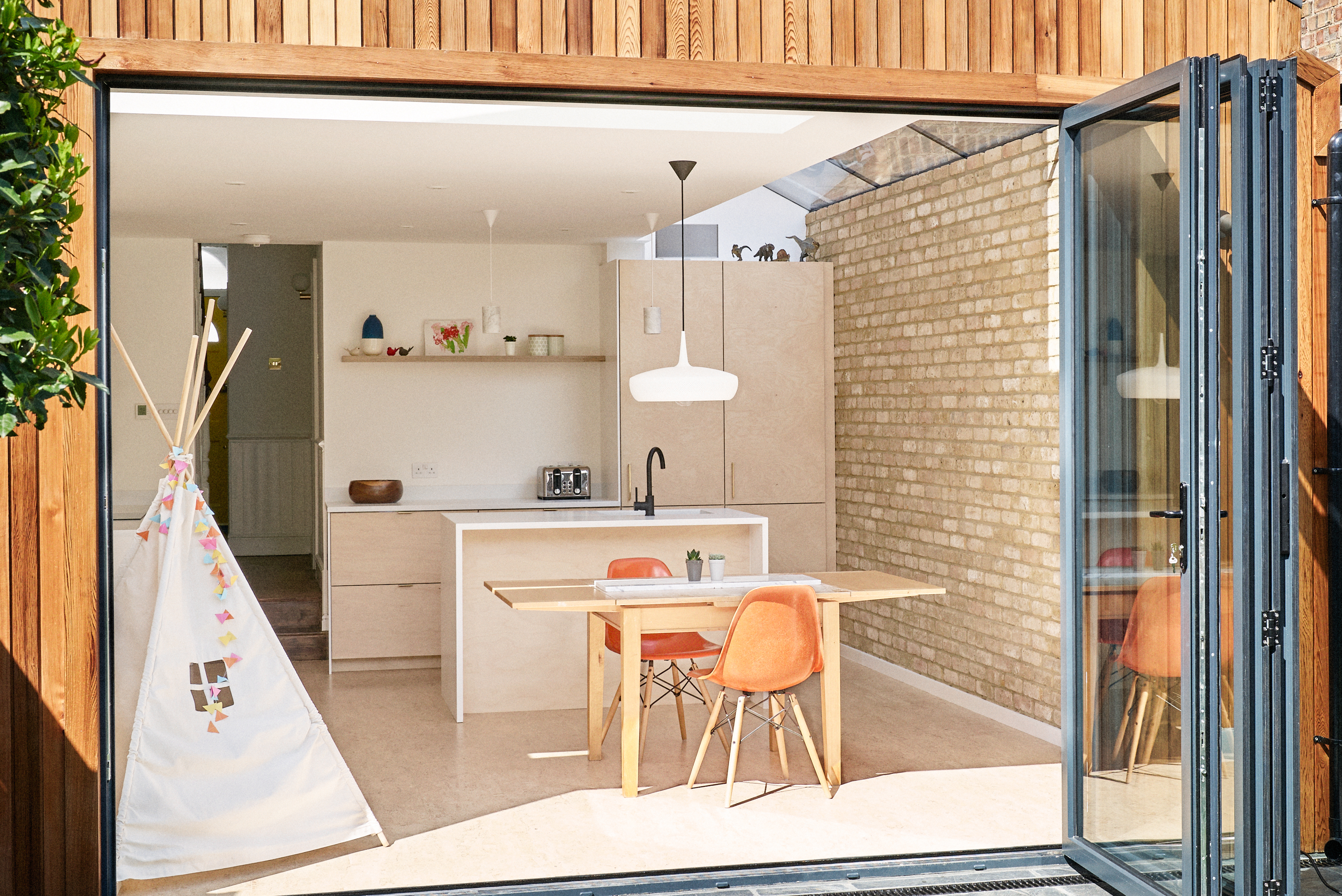 Birch plywood fronts and brass edge pulls handles in our Greville Road kitchen