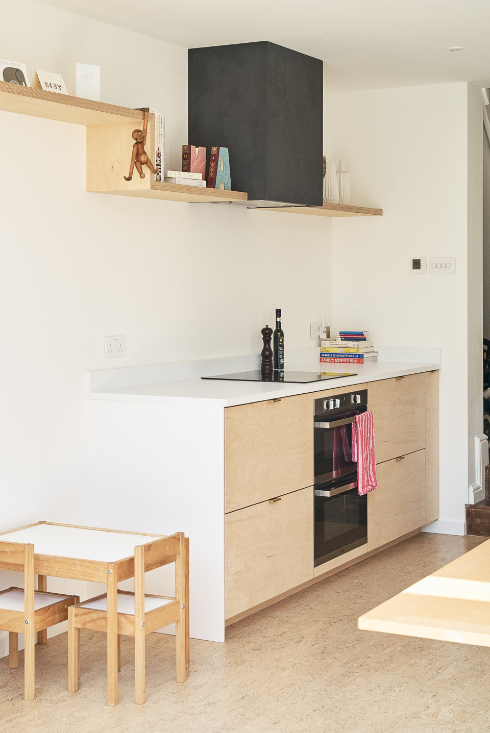 Birch plywood fronts and brass edge pulls handles in our Greville Road kitchen