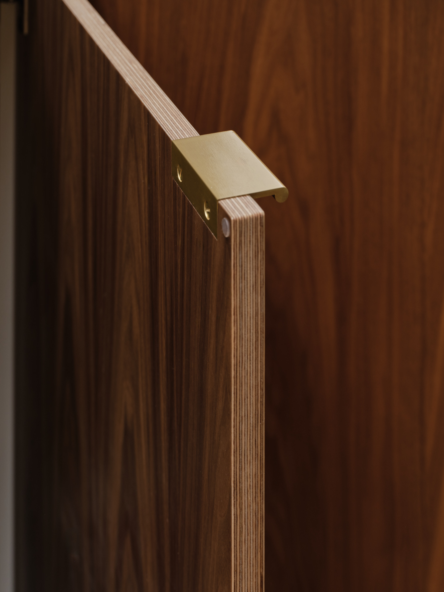 Plykea walnut veneered birch plywood door front with brass edge pull handle