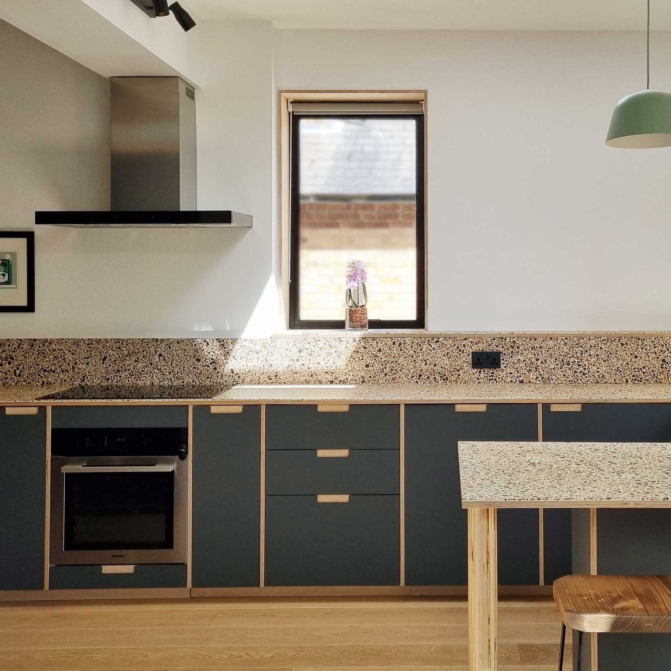 Plykea Fenix Verde Comodoro fronts with plywood spacer panels between each unit