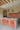 Plykea kitchen in green Fenix Bloom Verde Kitami, with a terrazzo worktop and pink tiles