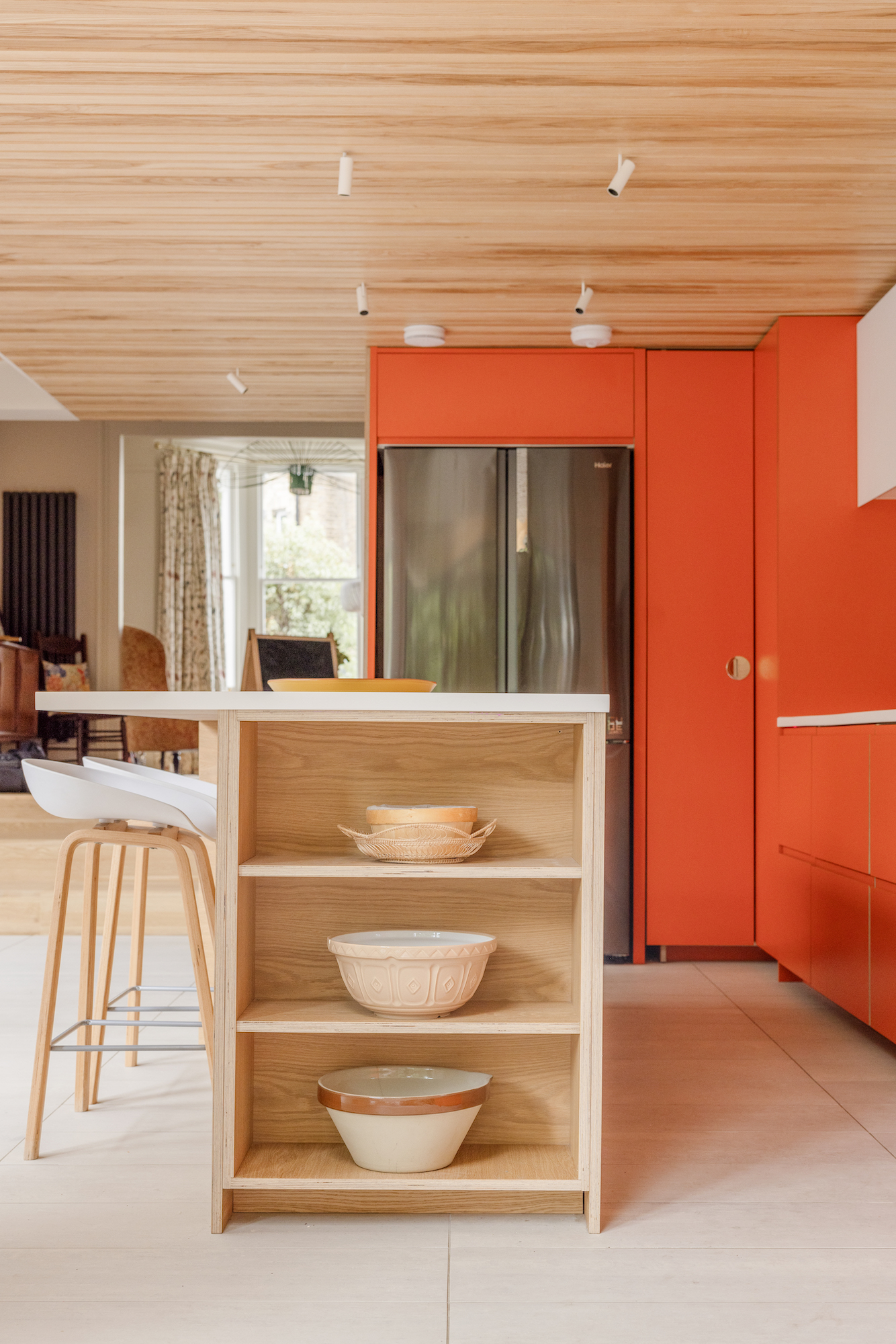 Plykea Formica Clementine with an oak Urtil shelving unit in the island