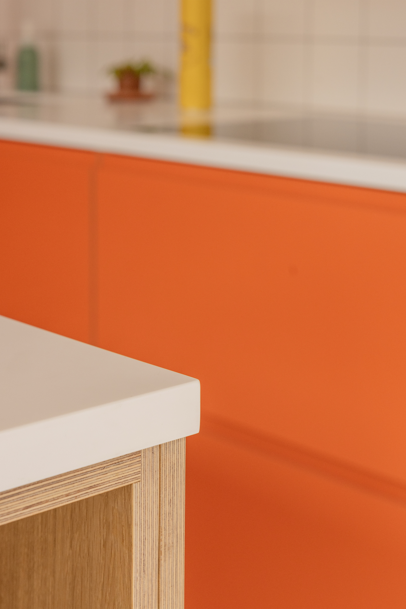 Plykea Formica Clementine with an oak Urtil shelving unit in the island
