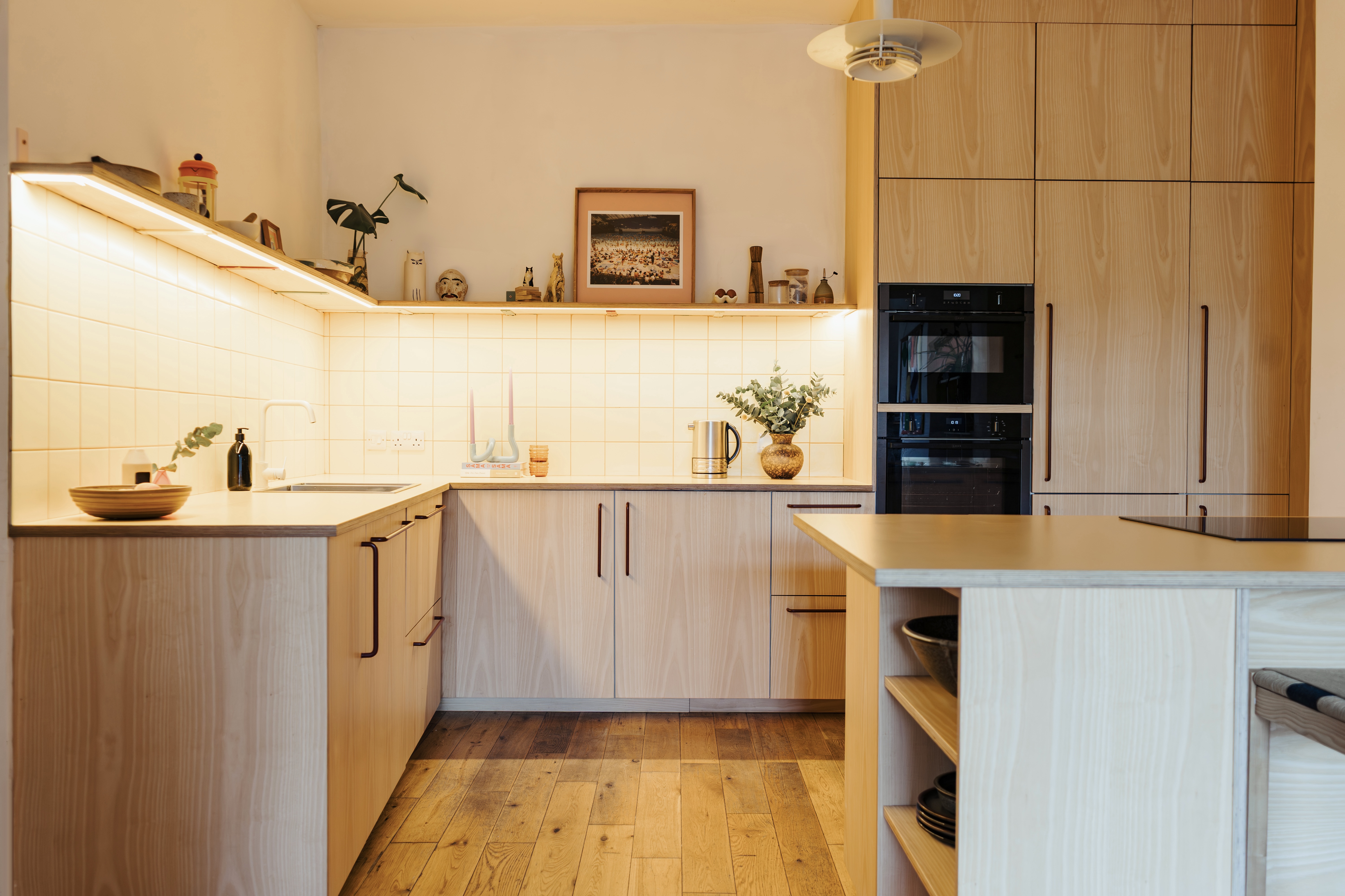 Plykea ash veneered birch plywood fronts with Swarf handles and Formica Tenere worktop