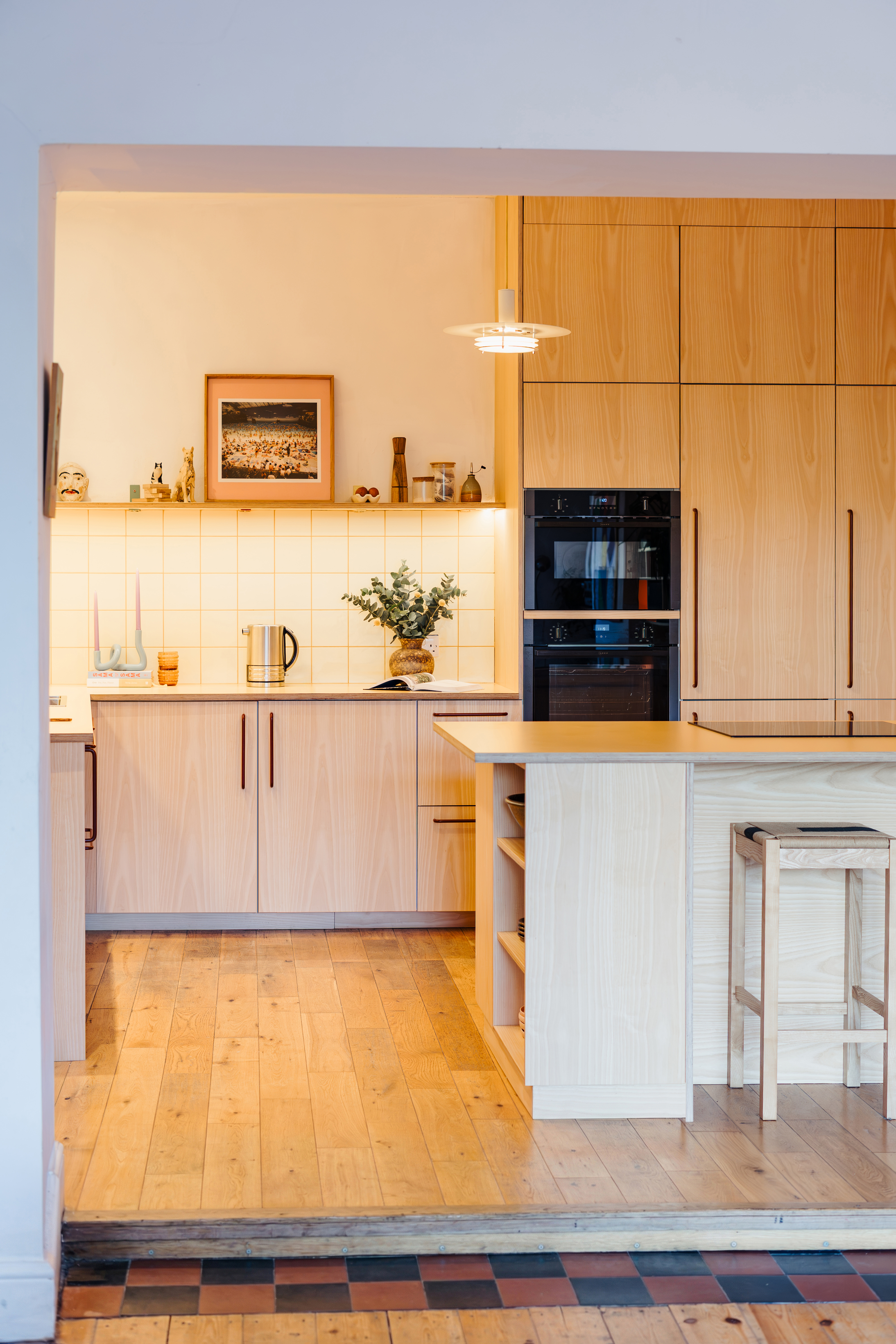 Plykea ash veneered birch plywood fronts with Swarf handles and Formica Tenere worktop