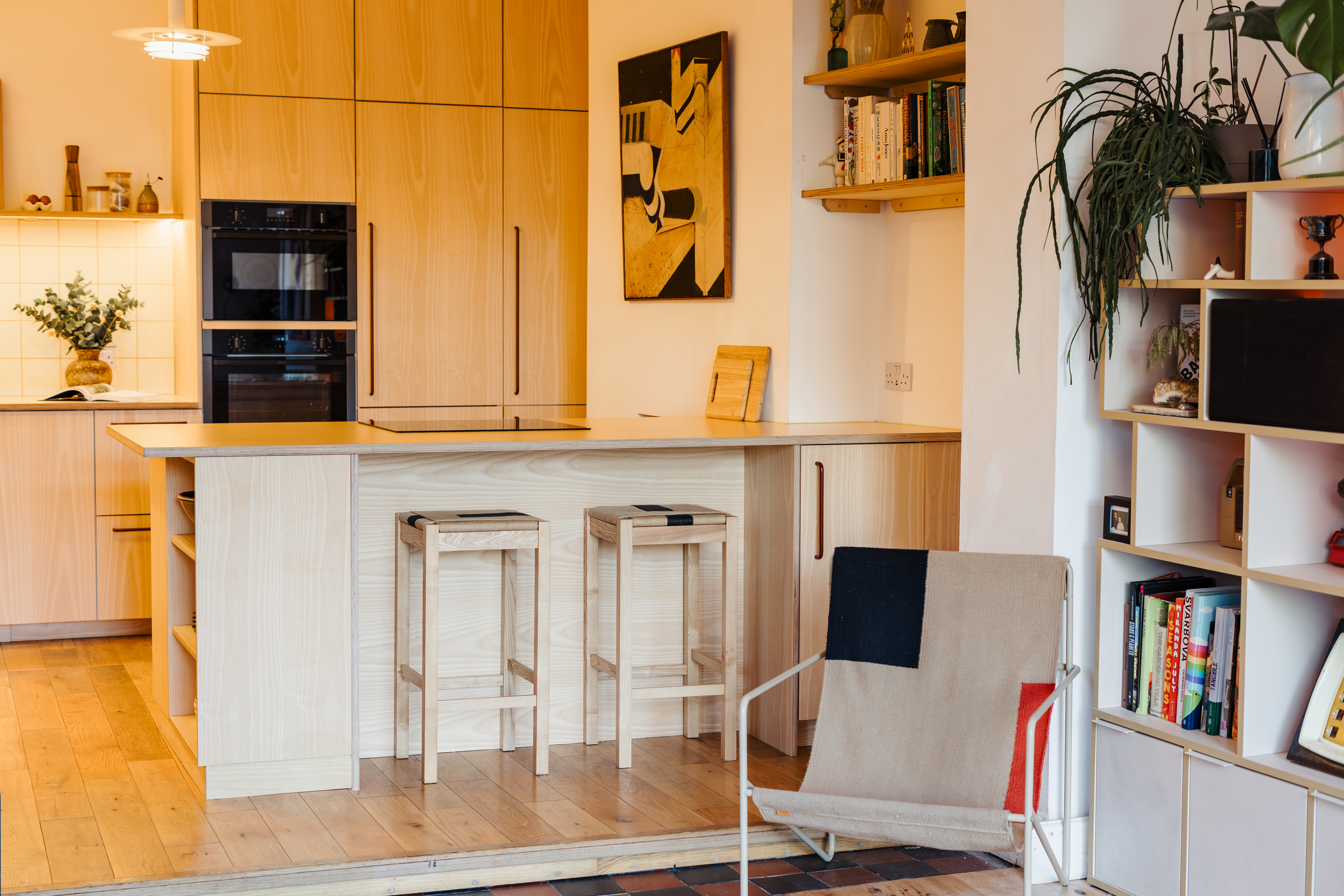 Plykea ash veneered birch plywood fronts with Swarf handles and Formica Tenere worktop