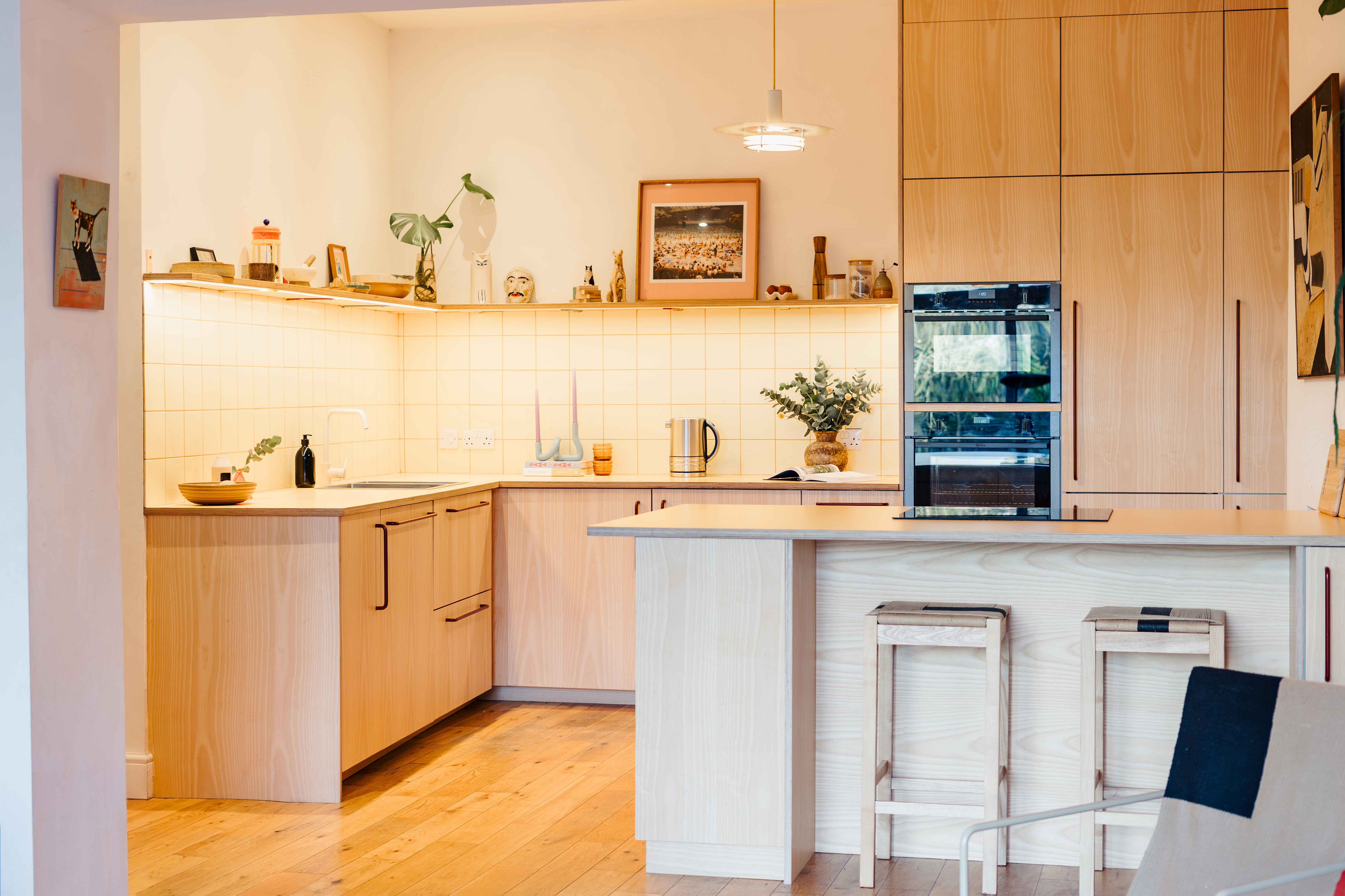 Plykea ash veneered birch plywood fronts with Swarf handles and Formica Tenere worktop