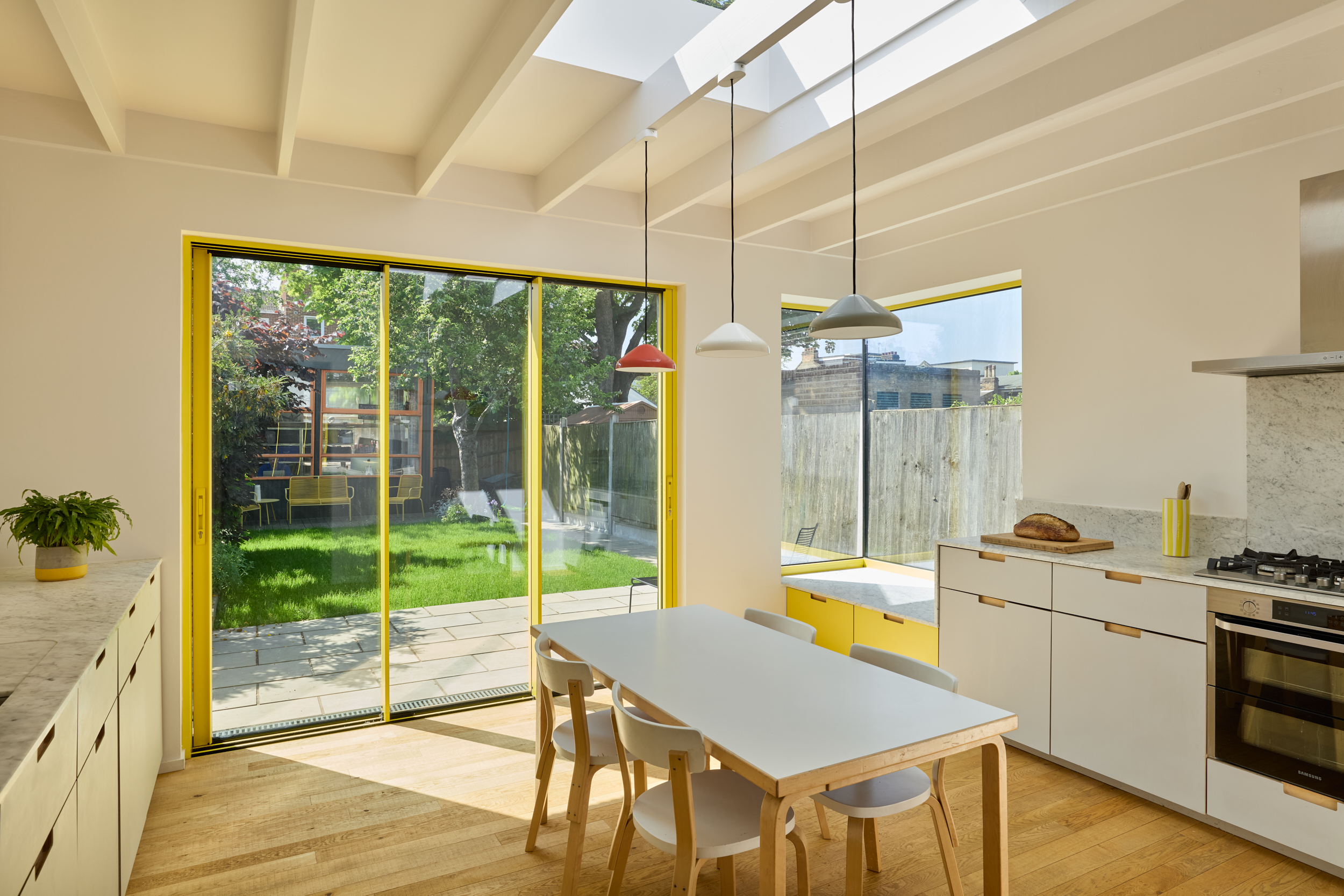 Plykea Fenix Grigio Efeso and Formica Chrome yellow plywood kitchen