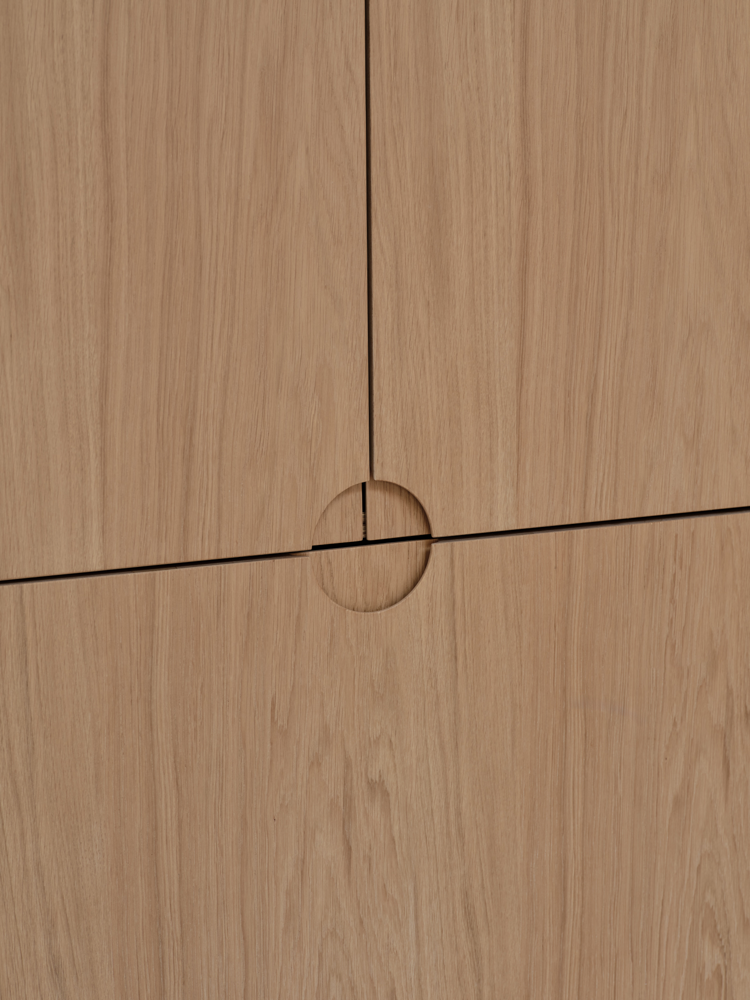 Oak-veneered birch plywood with quarter + half-arc handles