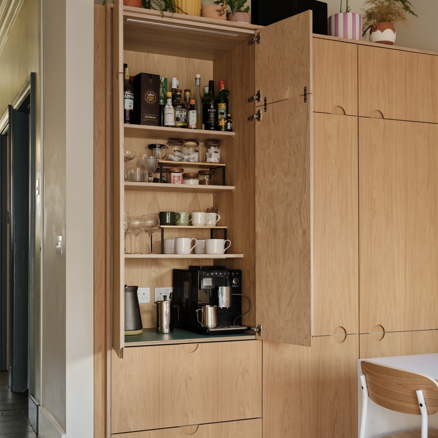Double doored 800mm oak veneered birch plywood pantry unit with a Fenix Bloom Verde Brac base