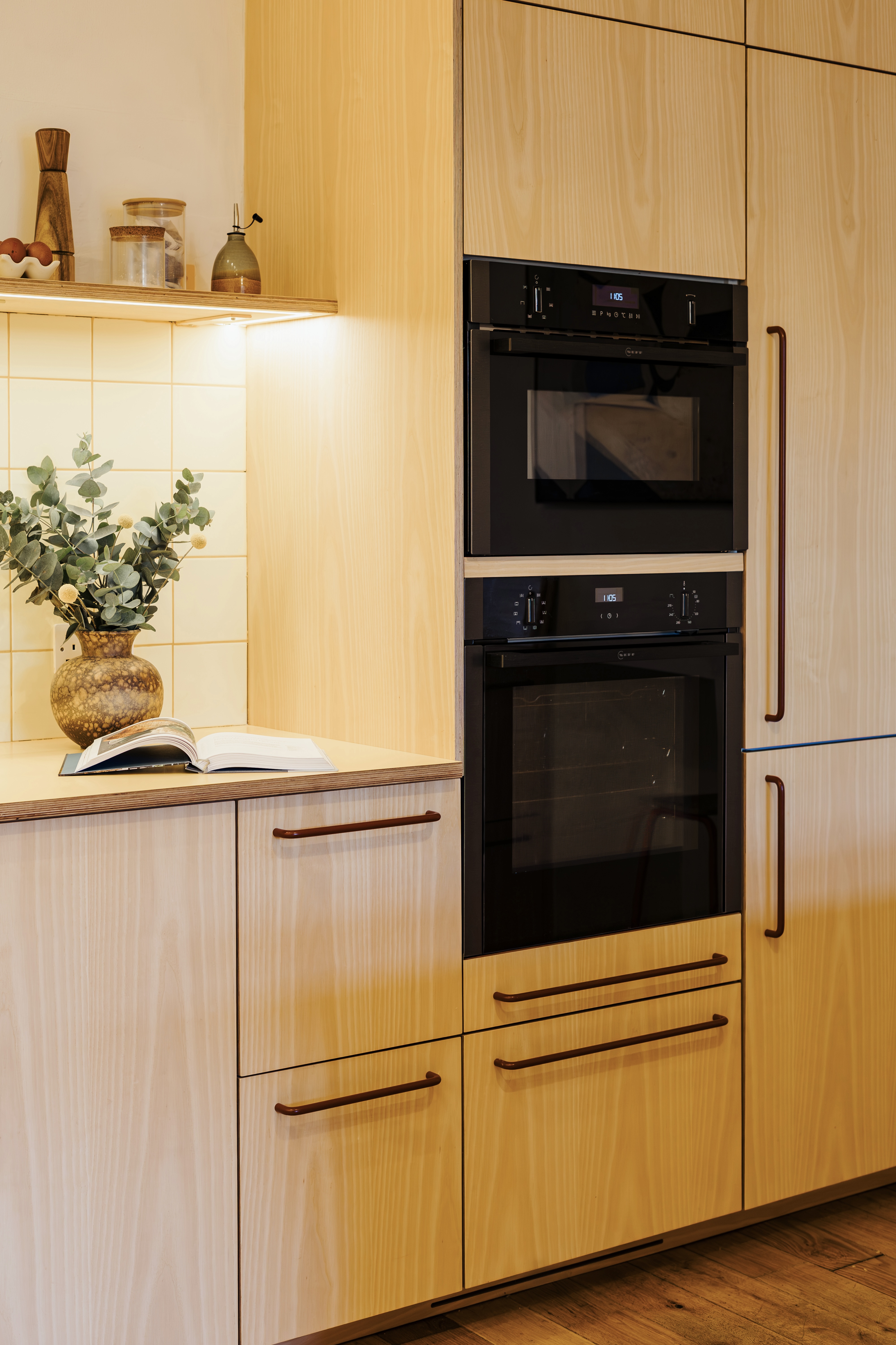 Plykea ash veneered birch plywood fronts with Swarf handles and yellow Formica Tenere worktop