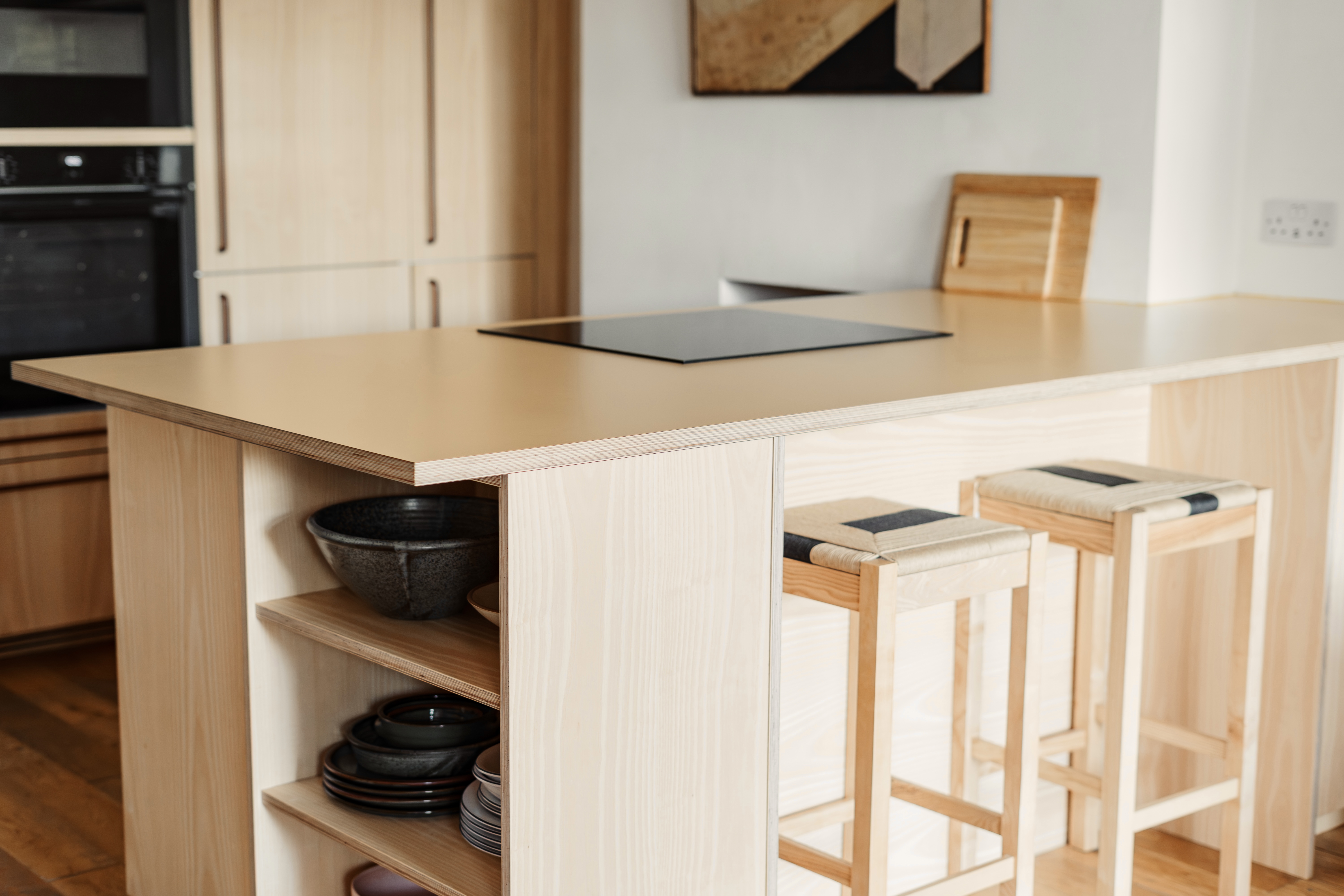 Plykea ash veneered birch plywood fronts with Swarf handles and yellow Formica Tenere worktop