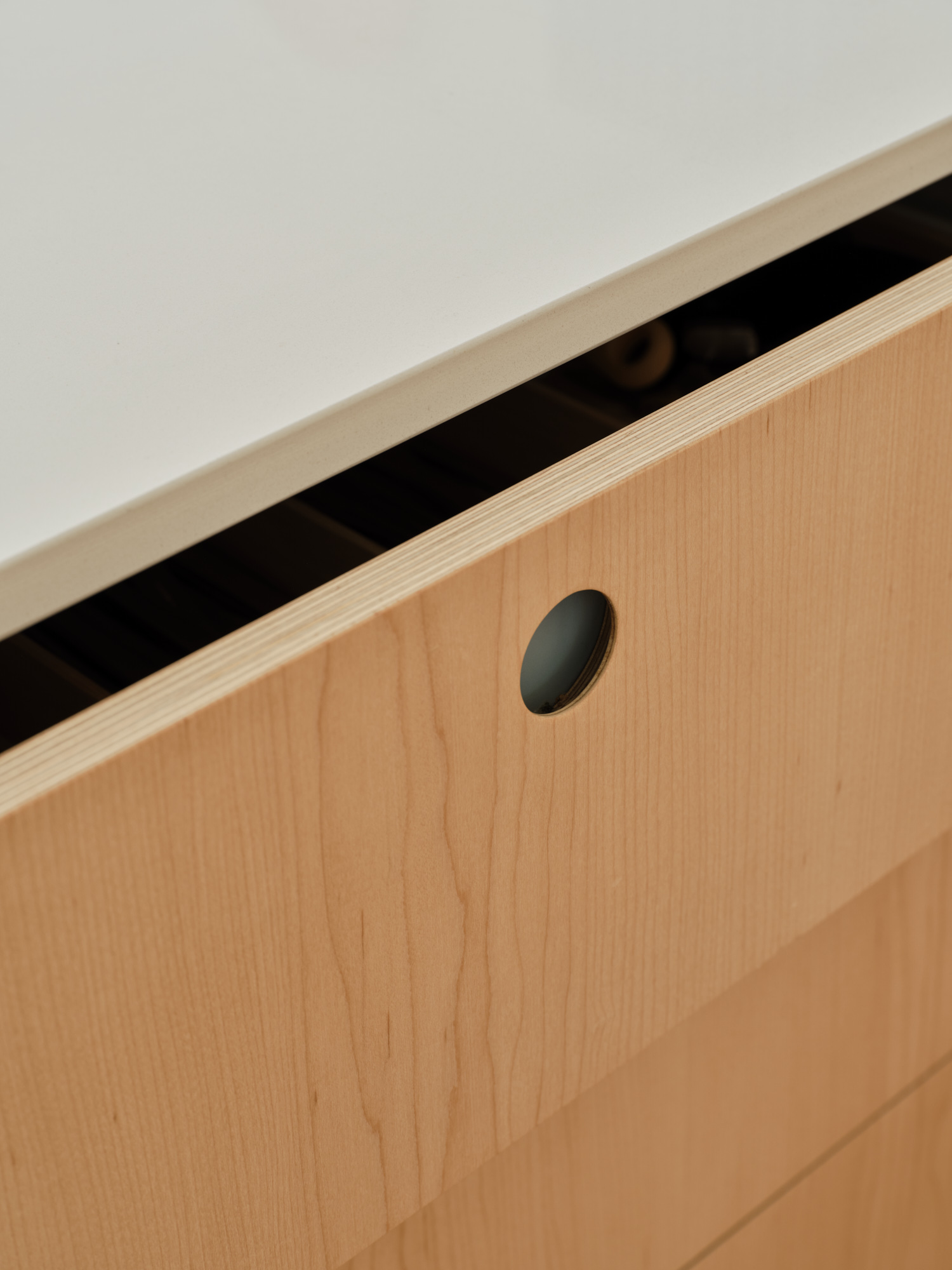 Plykea maple-veneered birch plywood + circular handles