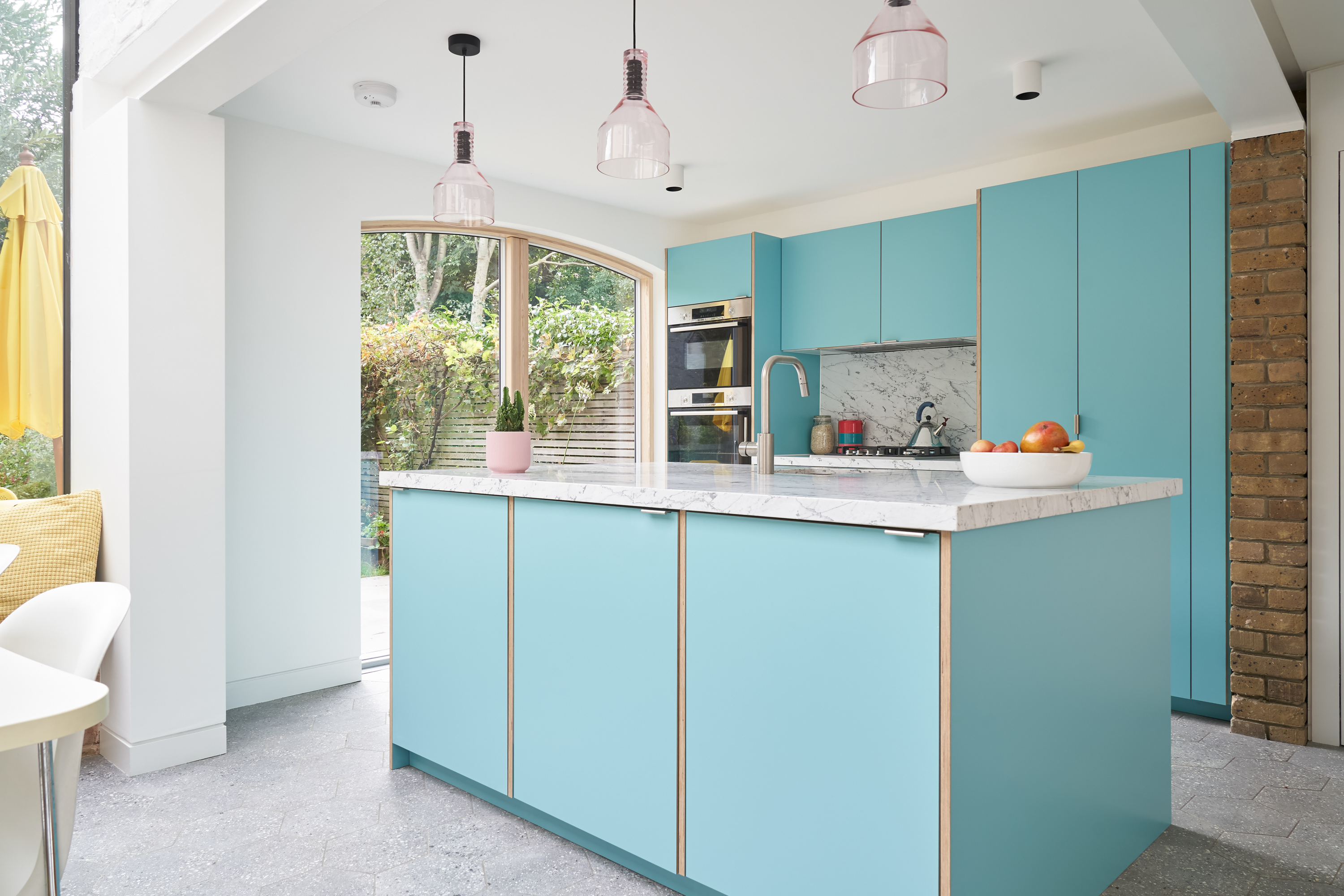 Plykea Formica Maui fronts with nickel edge pull handles and birch ply spacers on the island