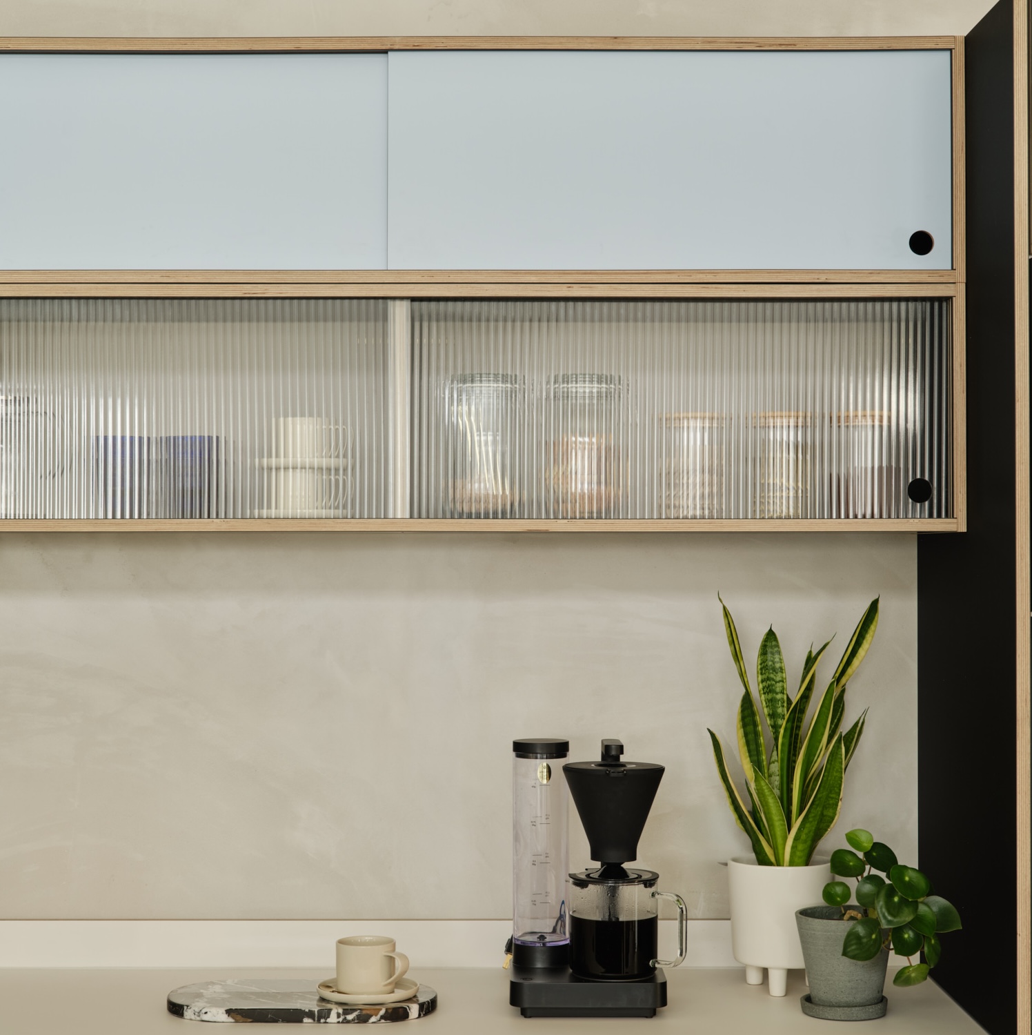 Plykea plywood modular shelving with reeded glass