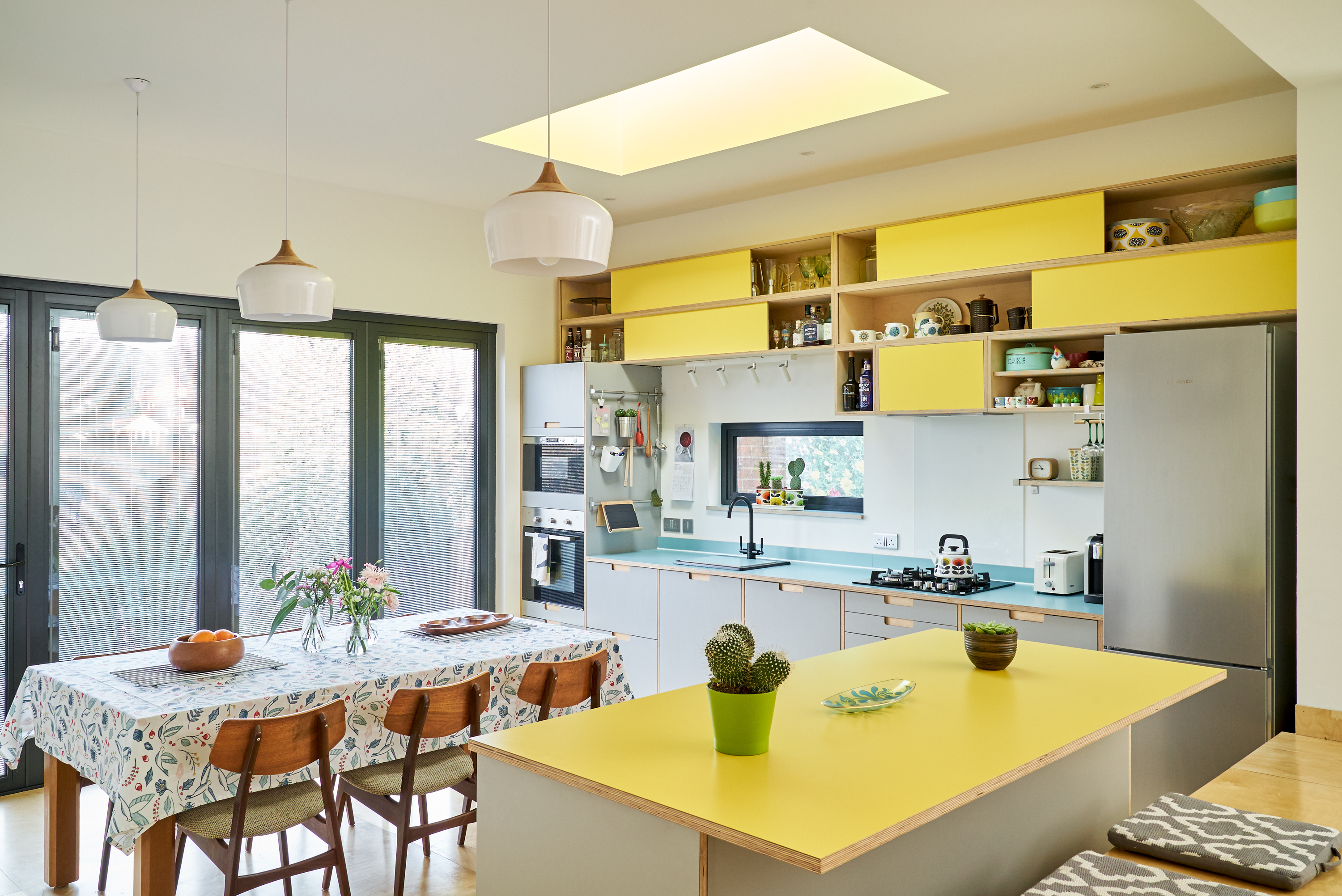 Fog and Chrome Yellow Formica fronts with Maui countertop and semi-recessed handles