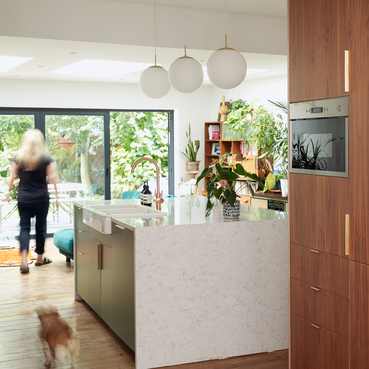 Hunter Green Formica, Walnut ply and brass edge pulls in our Forest Drive kitchen