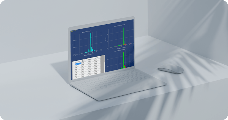 A laptop and a mouse showing bar chart graphs