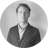 An image of a man in a blazer in greyscale