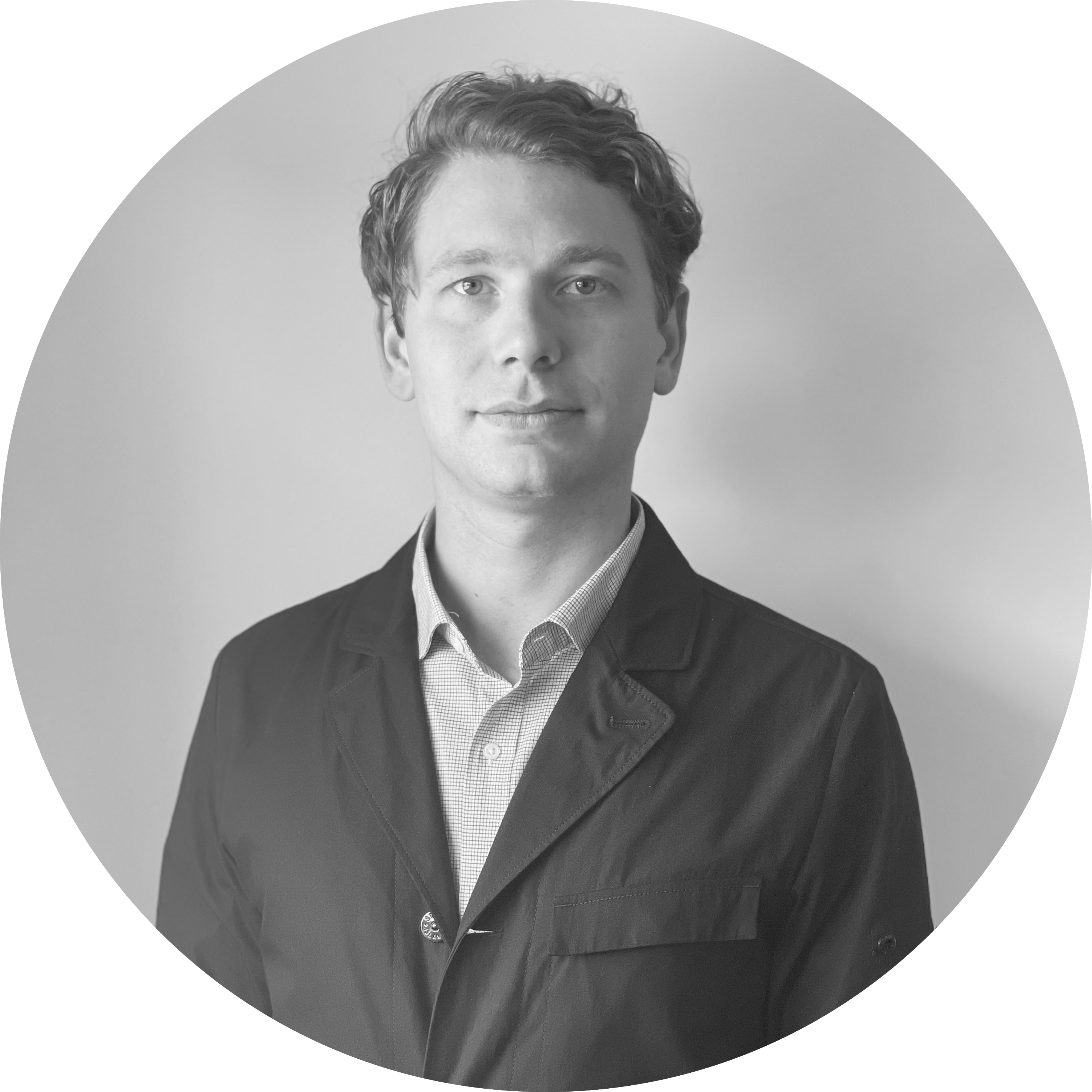An image of a man in a blazer in greyscale