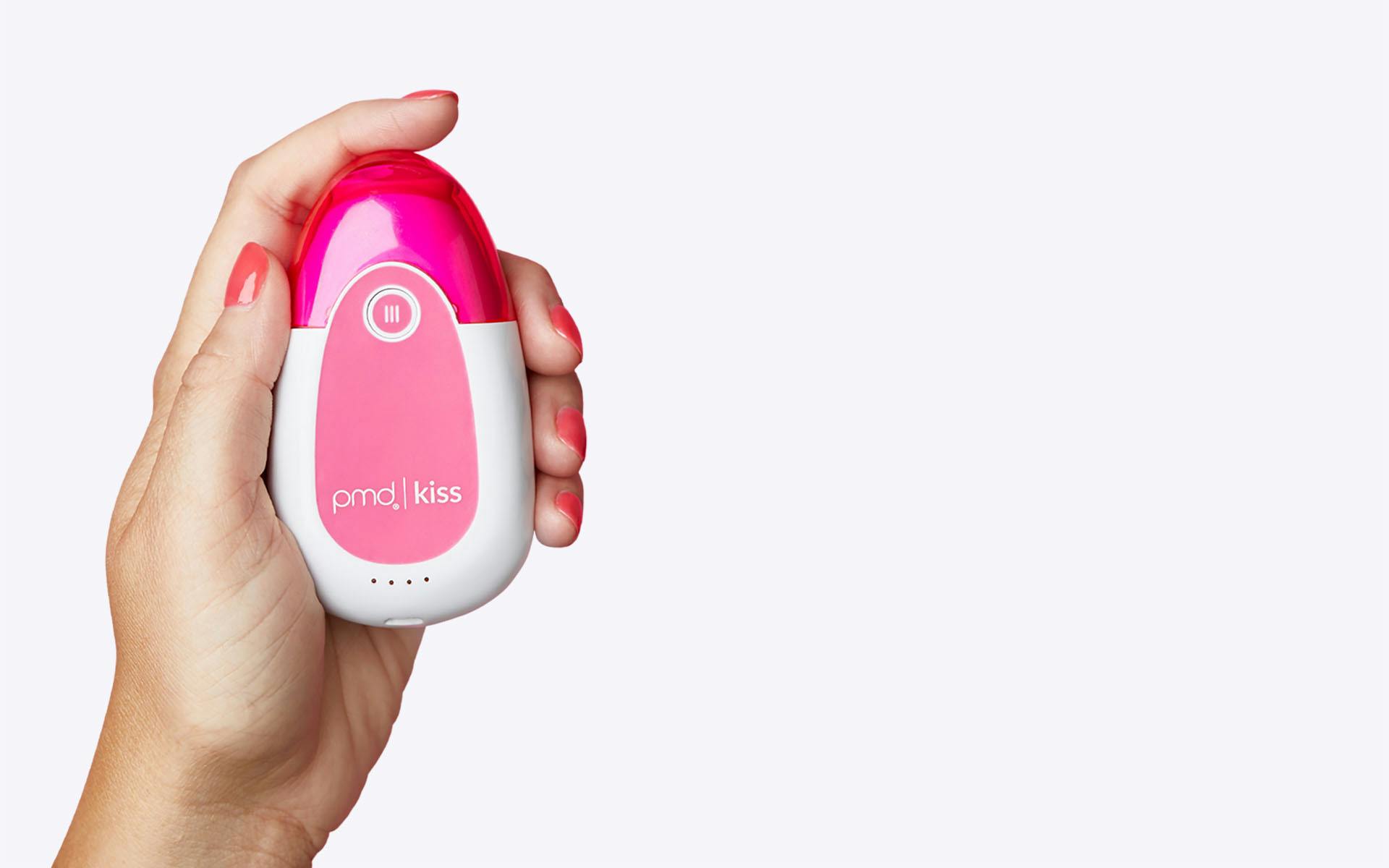 Woman holding PMD Kiss System