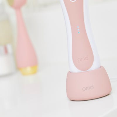 Rose Personal Microderm Elite Pro device standing on charging base