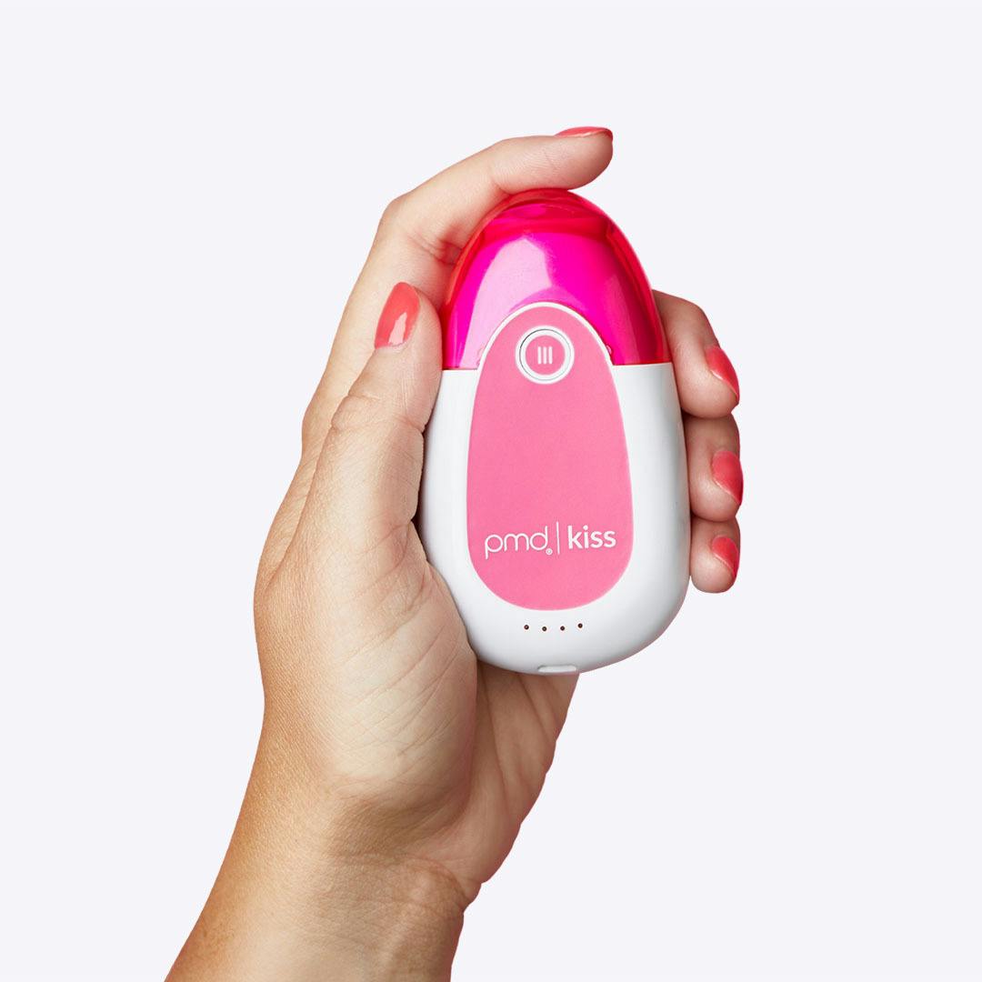 Woman holding PMD Kiss System