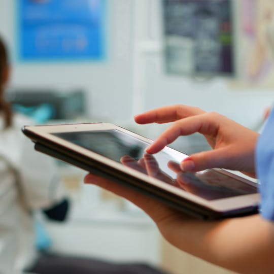 One person's hand using a tablet