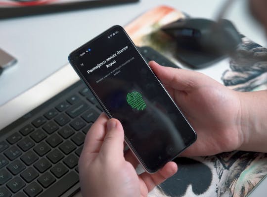 Smart phone with a green finger print image