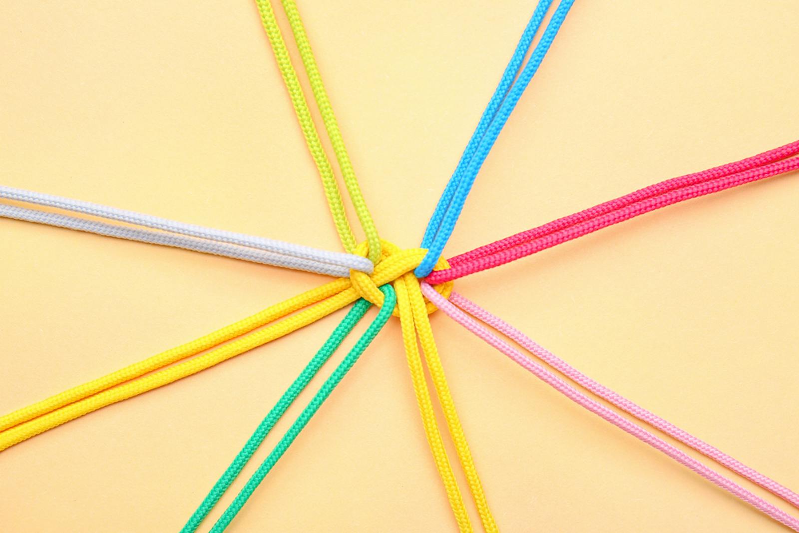 Colour ropes tied together to signify teamwork 