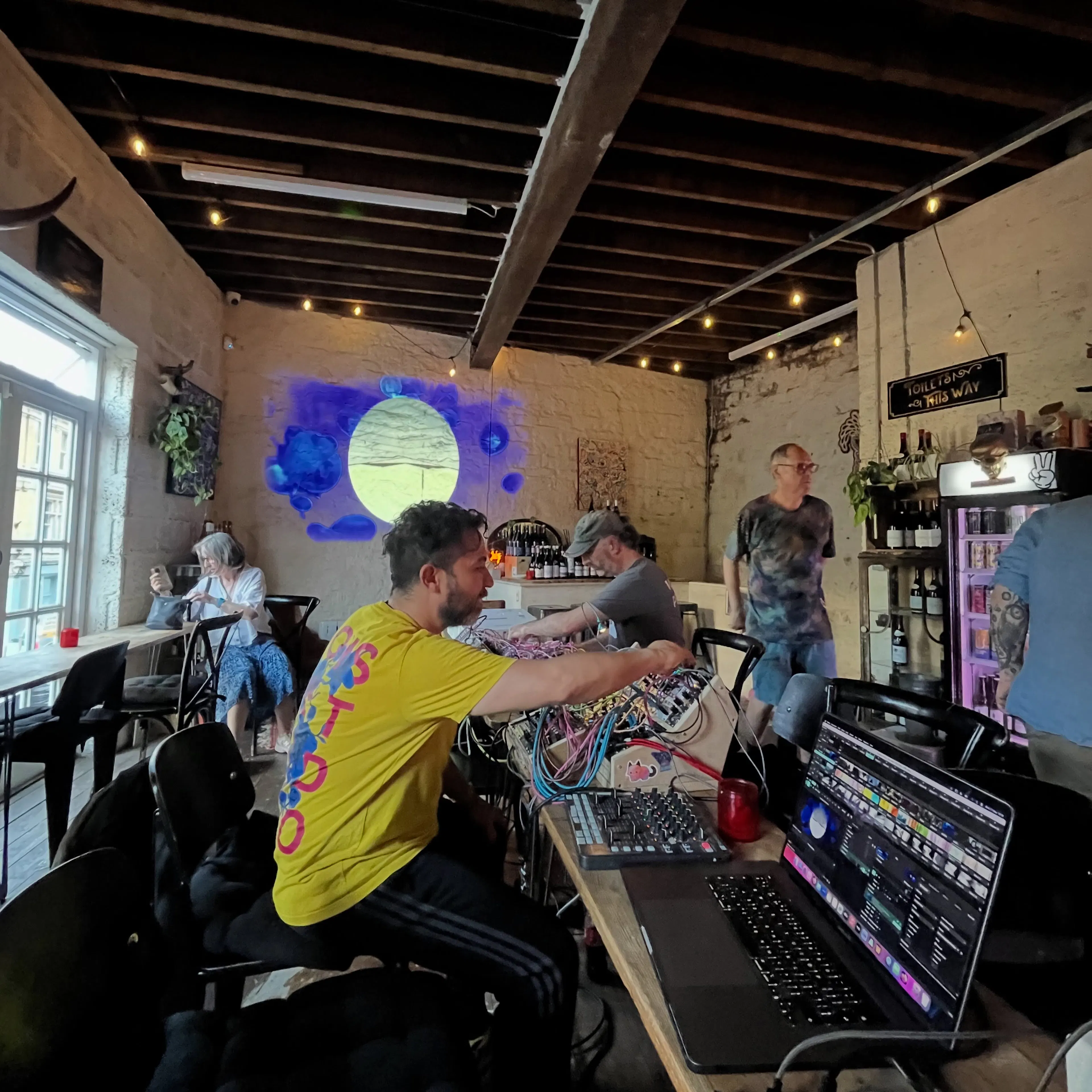 A close-up of Pablo Villierezz (@pantherpantherav) performing inside wolf wine.
