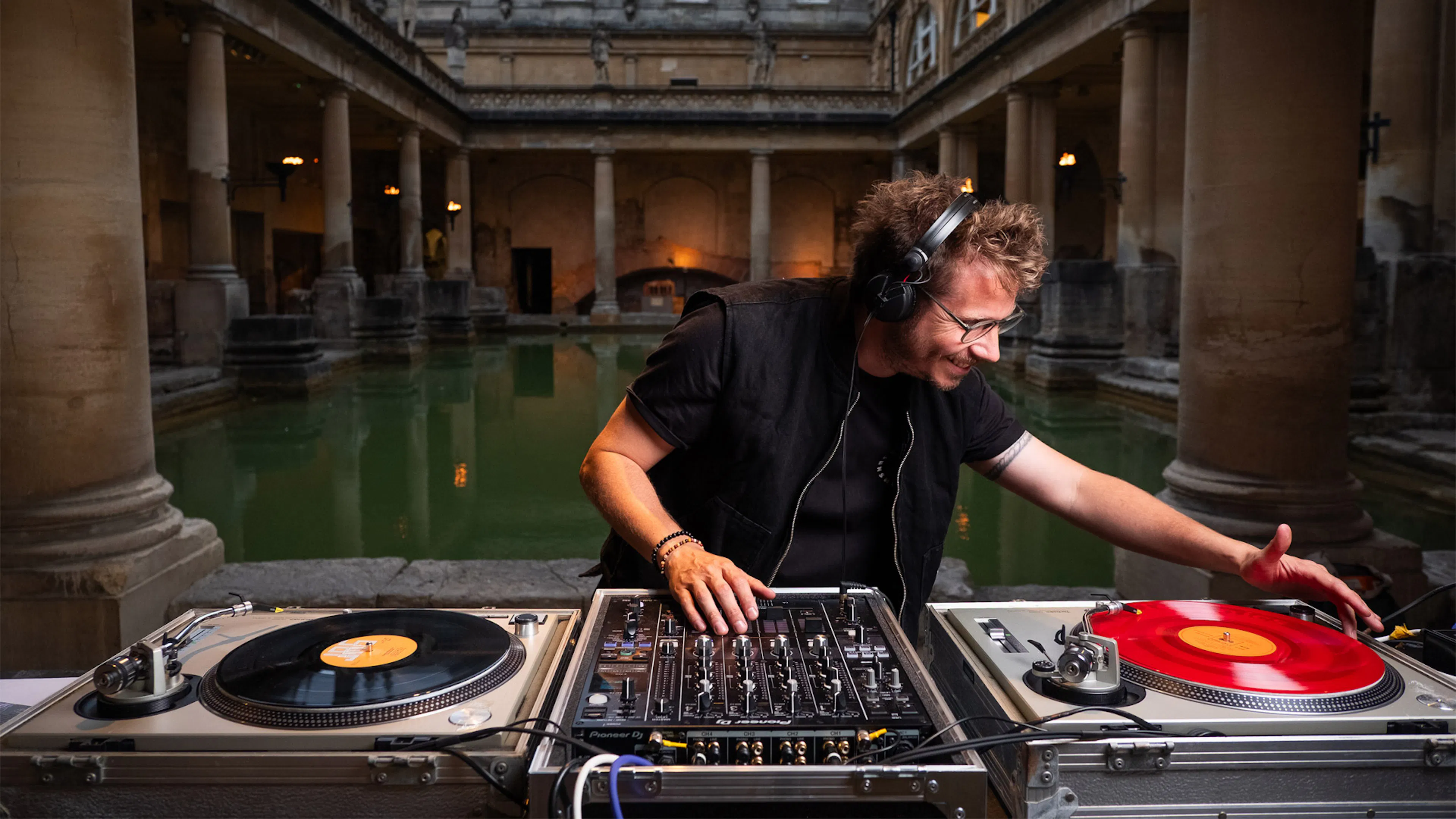 Stu Matson playing vinyl records inside the Great Bath at The Roman Baths. 
