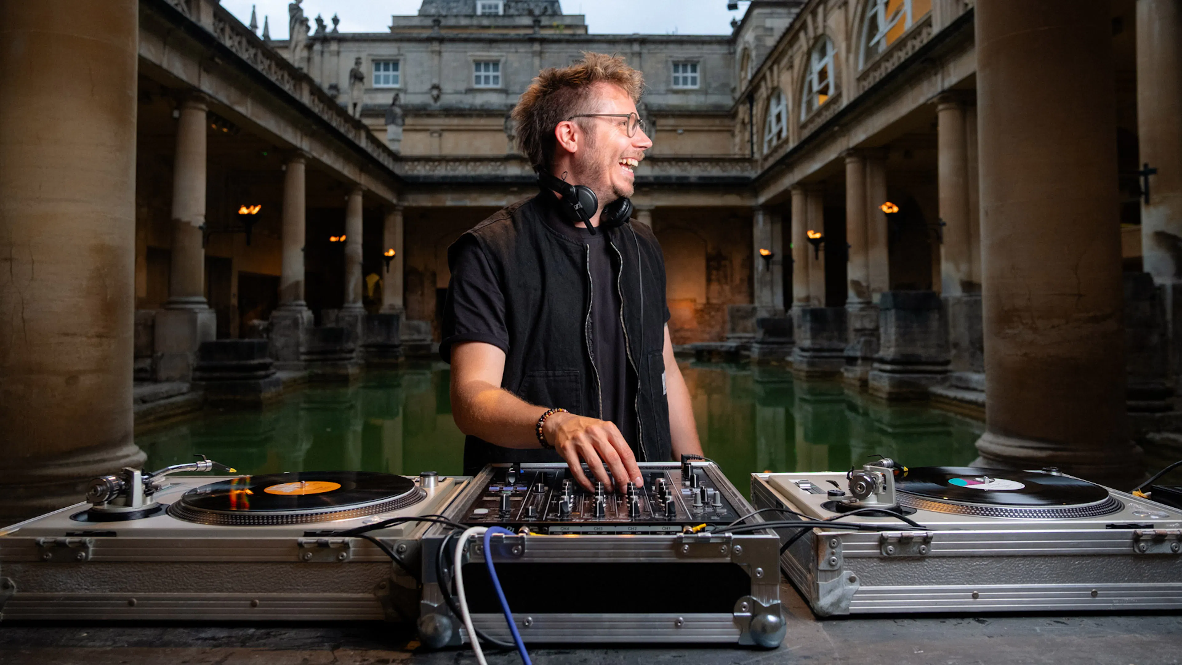 Stu Matson spinning vinyl inside the Great Bath at the Roman Baths in England. 