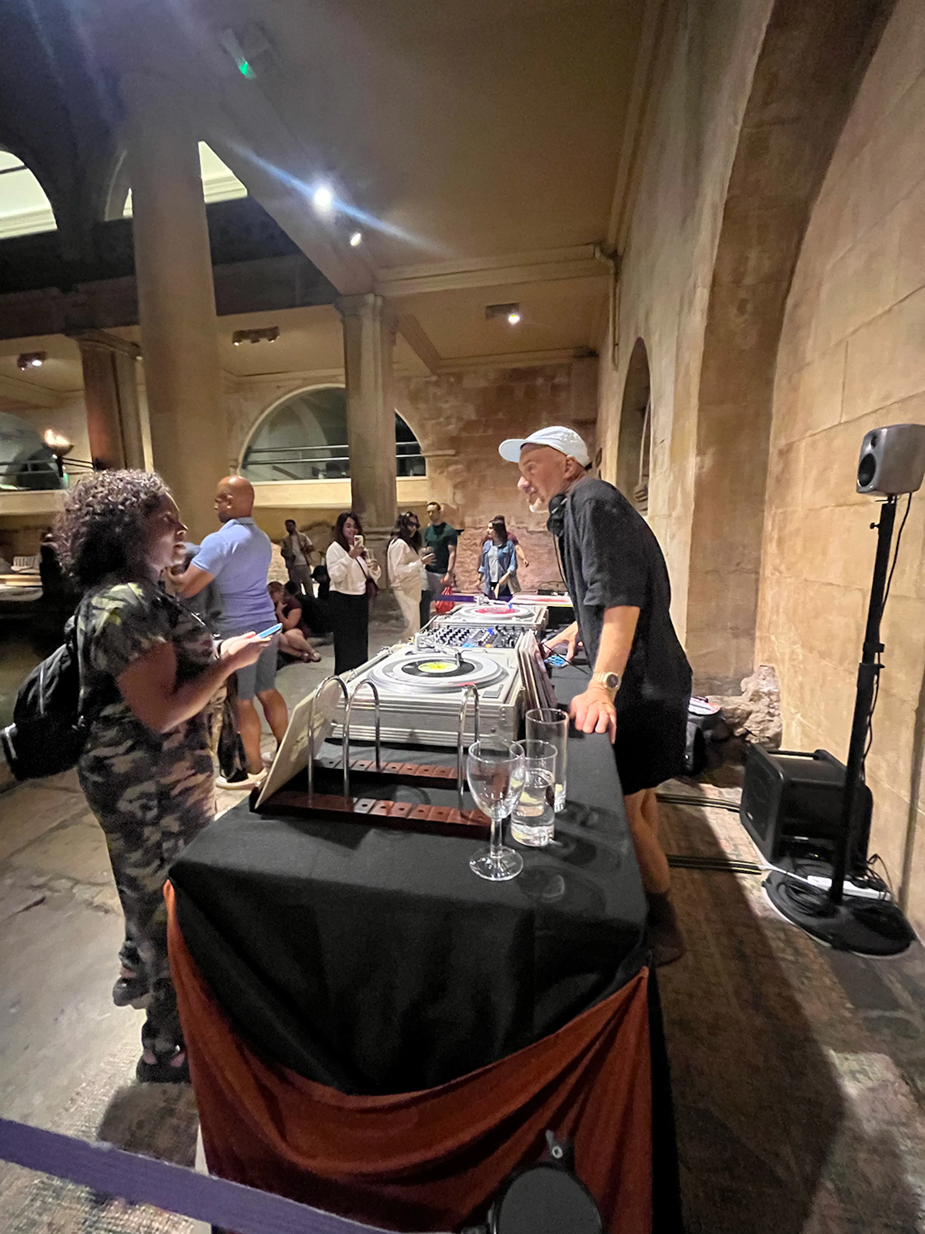 Tim Spencer talking to an audience member inside the Roman Baths.
