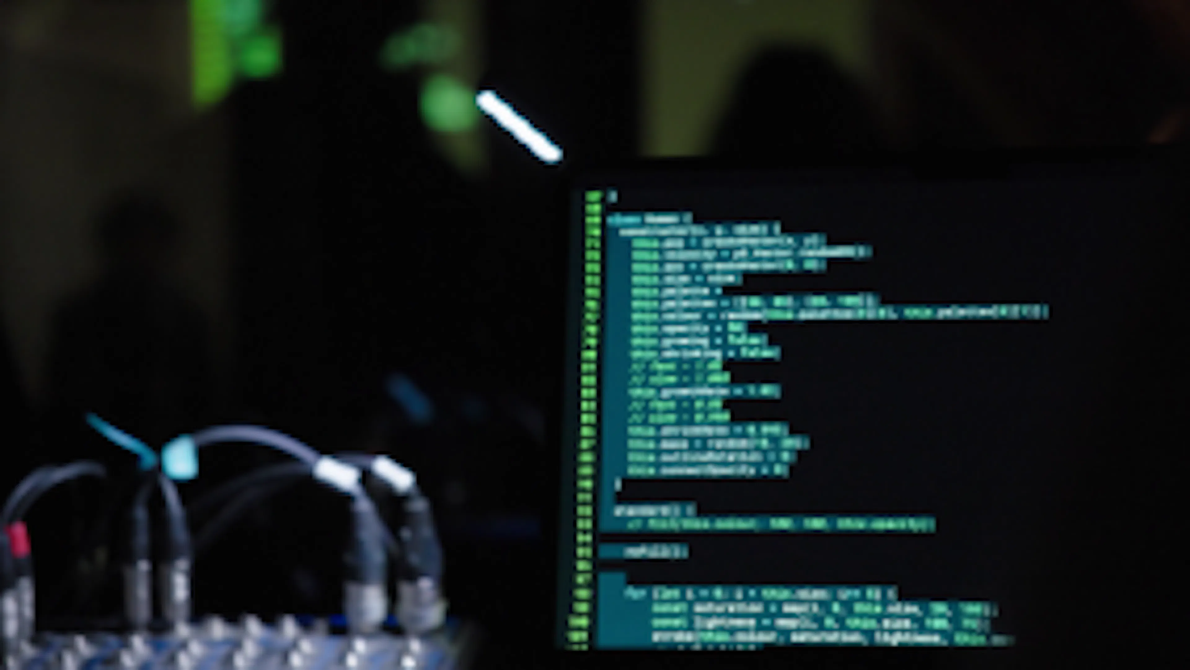 Close up of p5.js code on a laptop in the dark. 