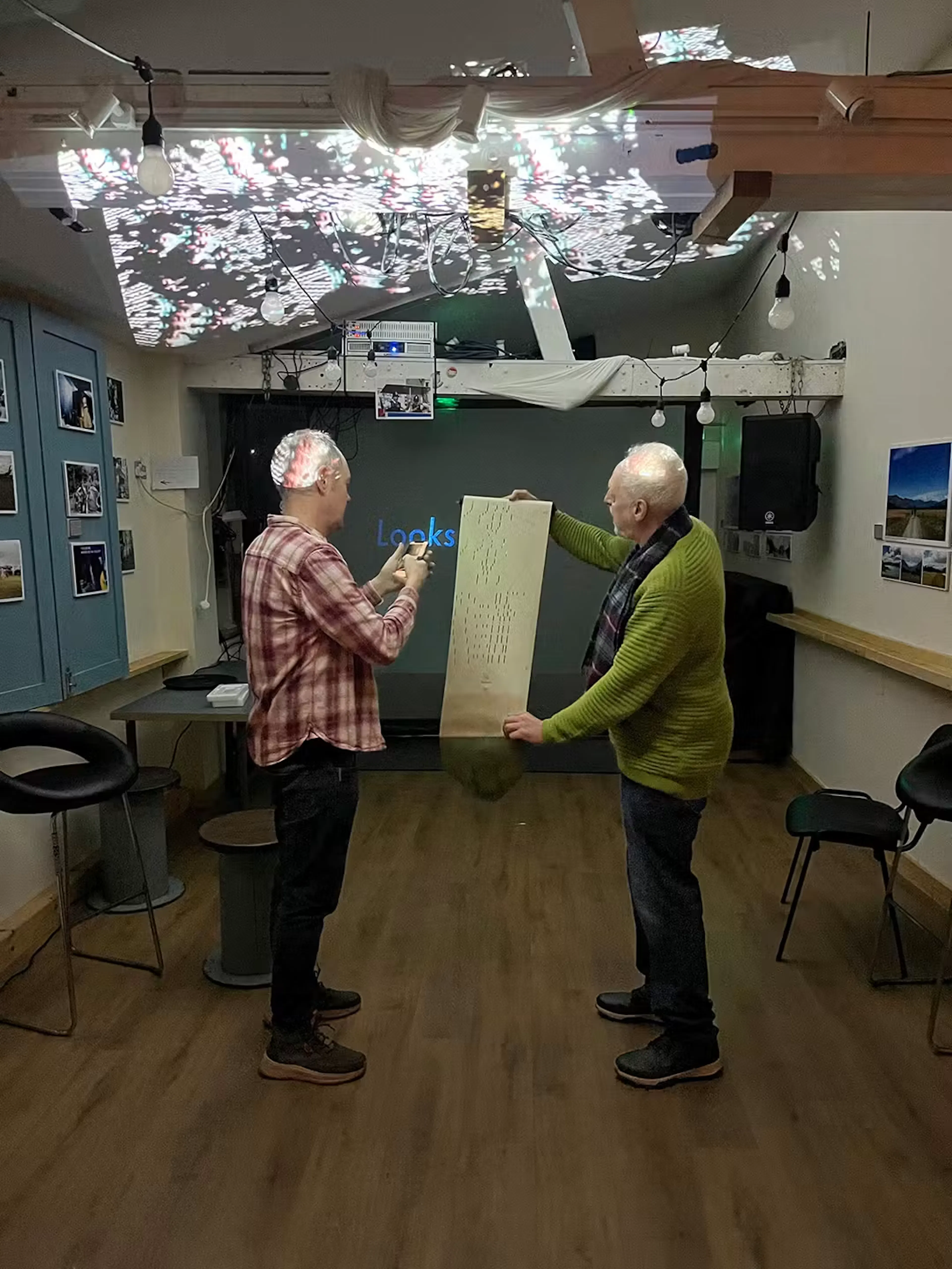 Dave Webb and Brian Gibson showing Brian's paper-based work at the audio visual meet-up.